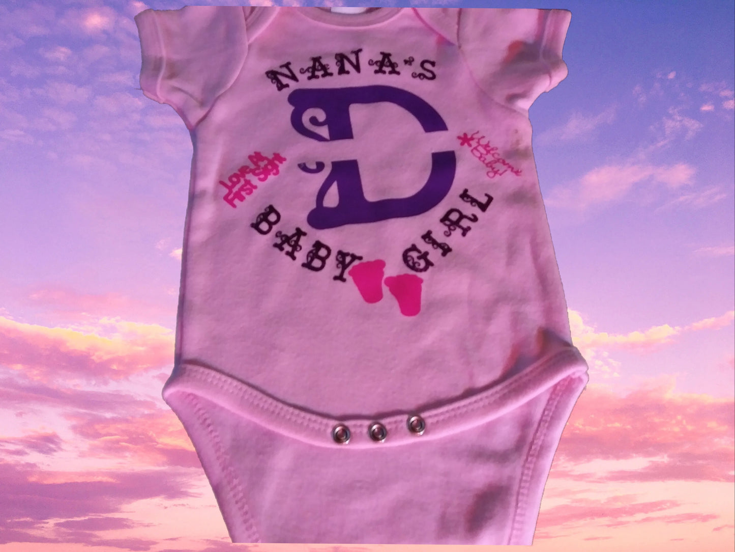 Size 0-3 months 100% cotton Pink Personalized baby girl's Oneies with the letter D and name in the middle.