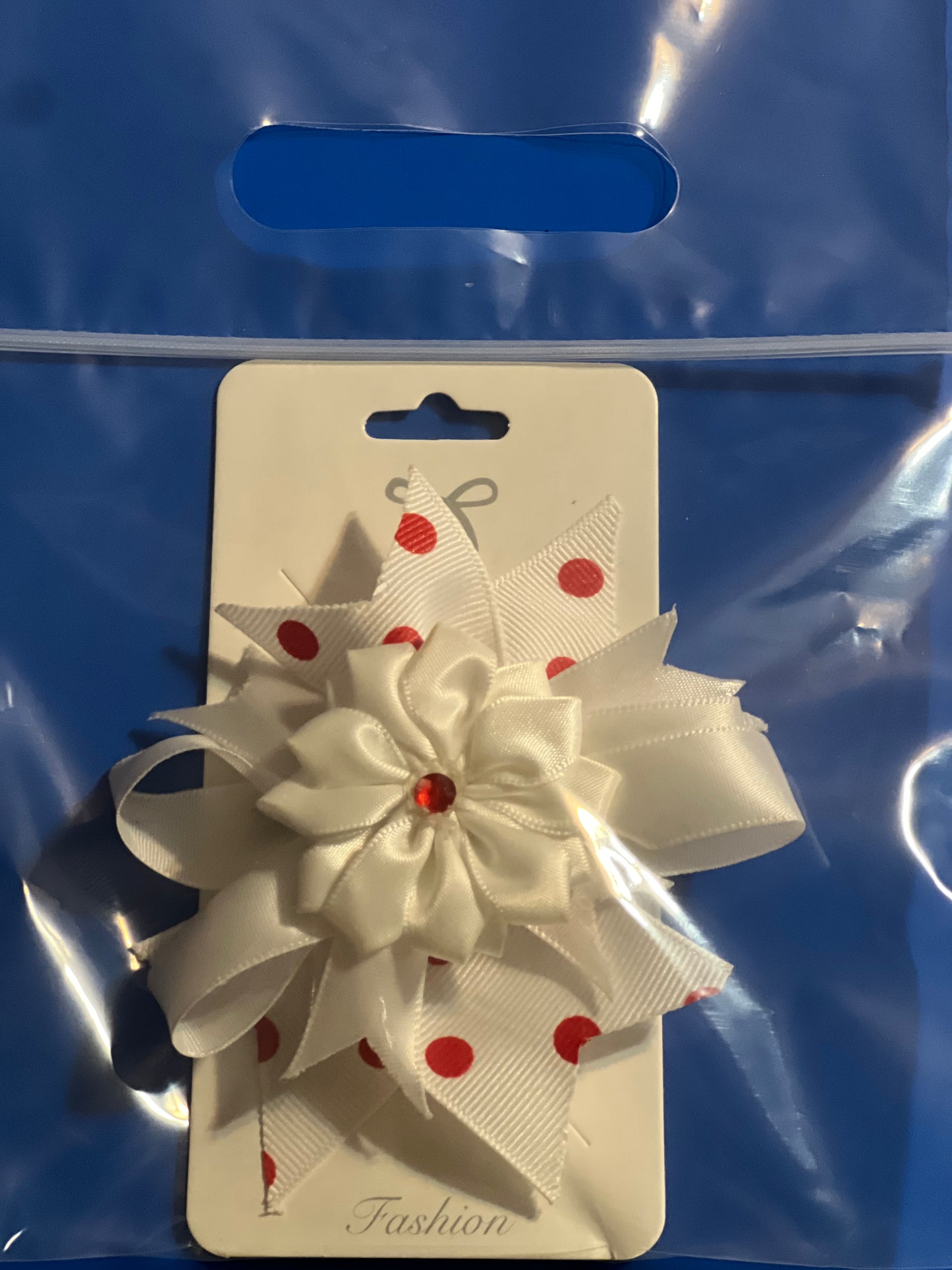 White flowery with red dots hair bow