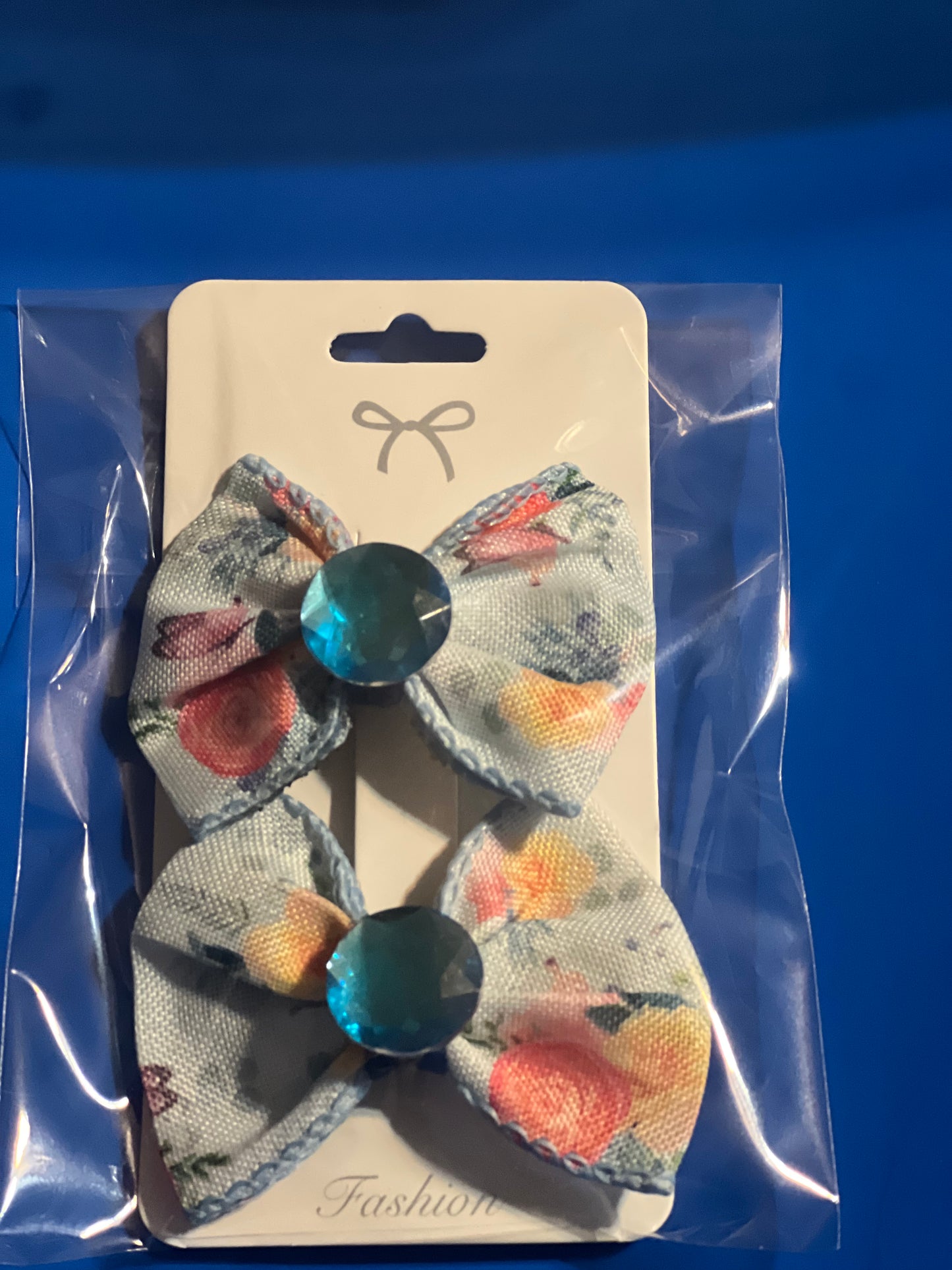 2 little girls blue hair bows