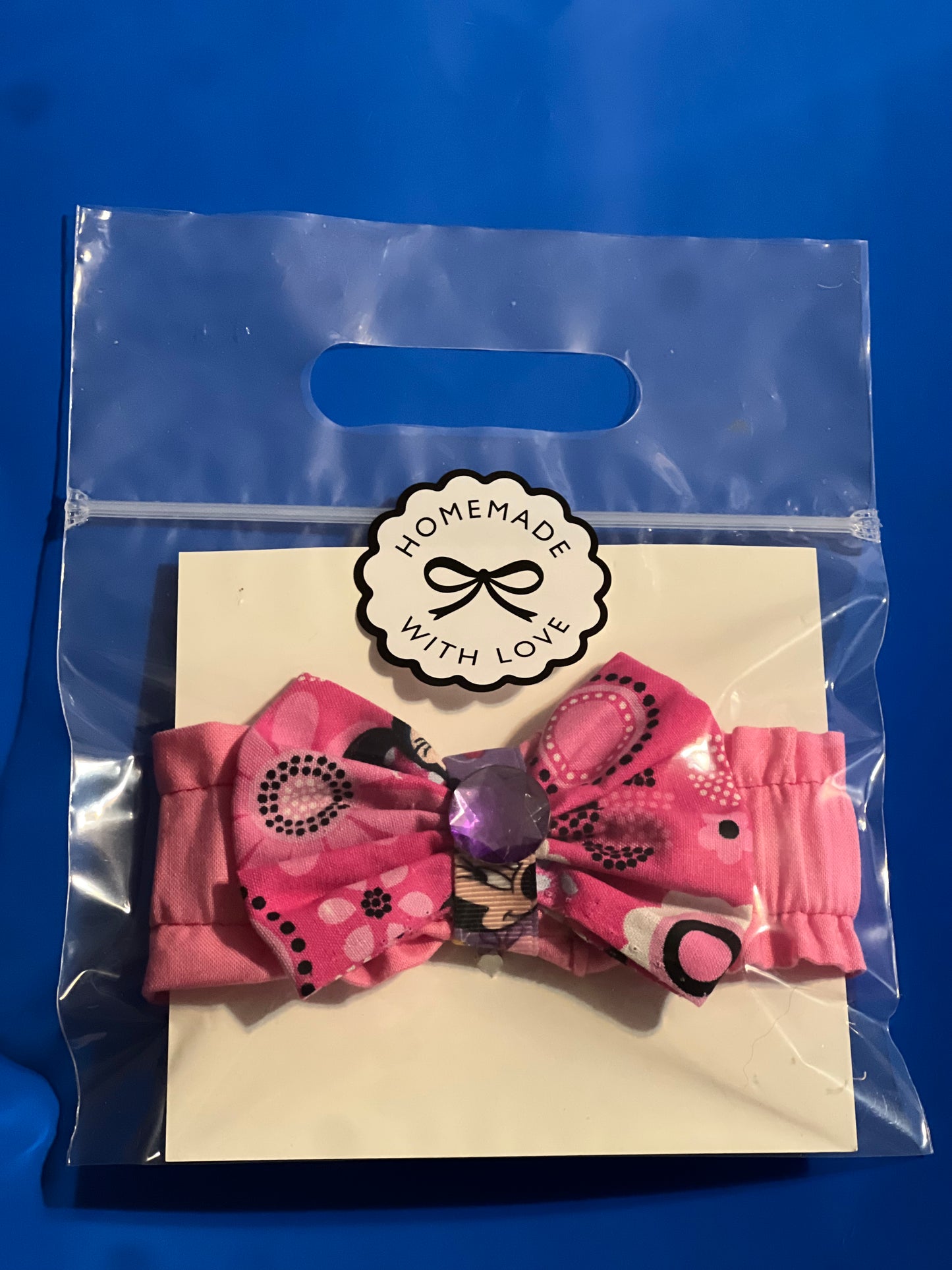 Mickey Mouse with purple gemstone hair bow
