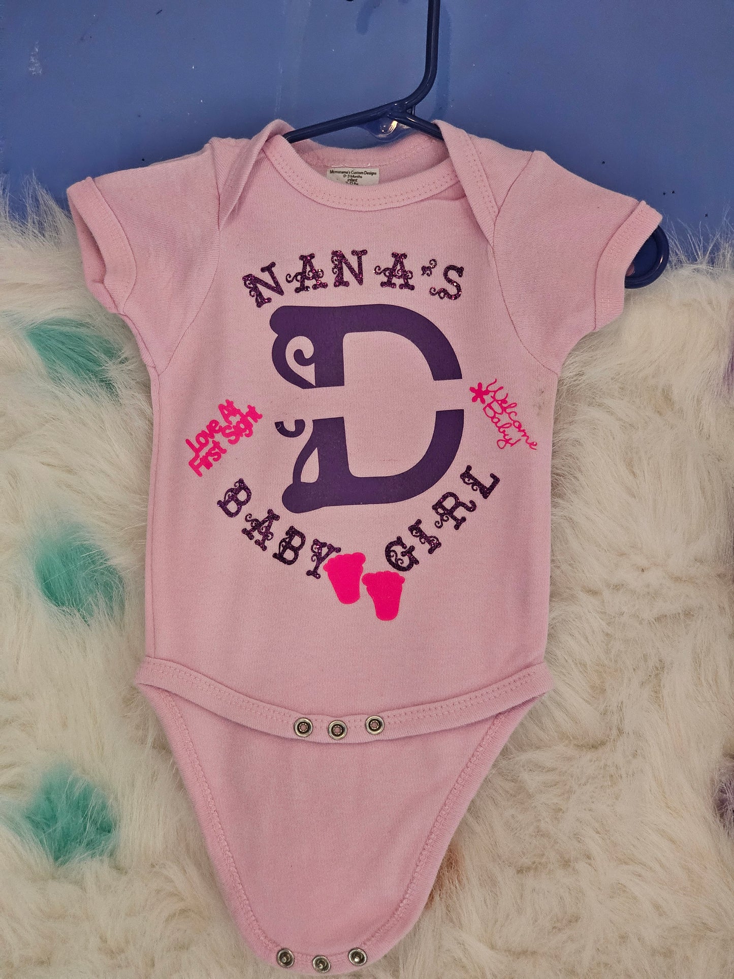 Size 0-3 months 100% cotton Pink Personalized baby girl's Oneies with the letter D and name in the middle.