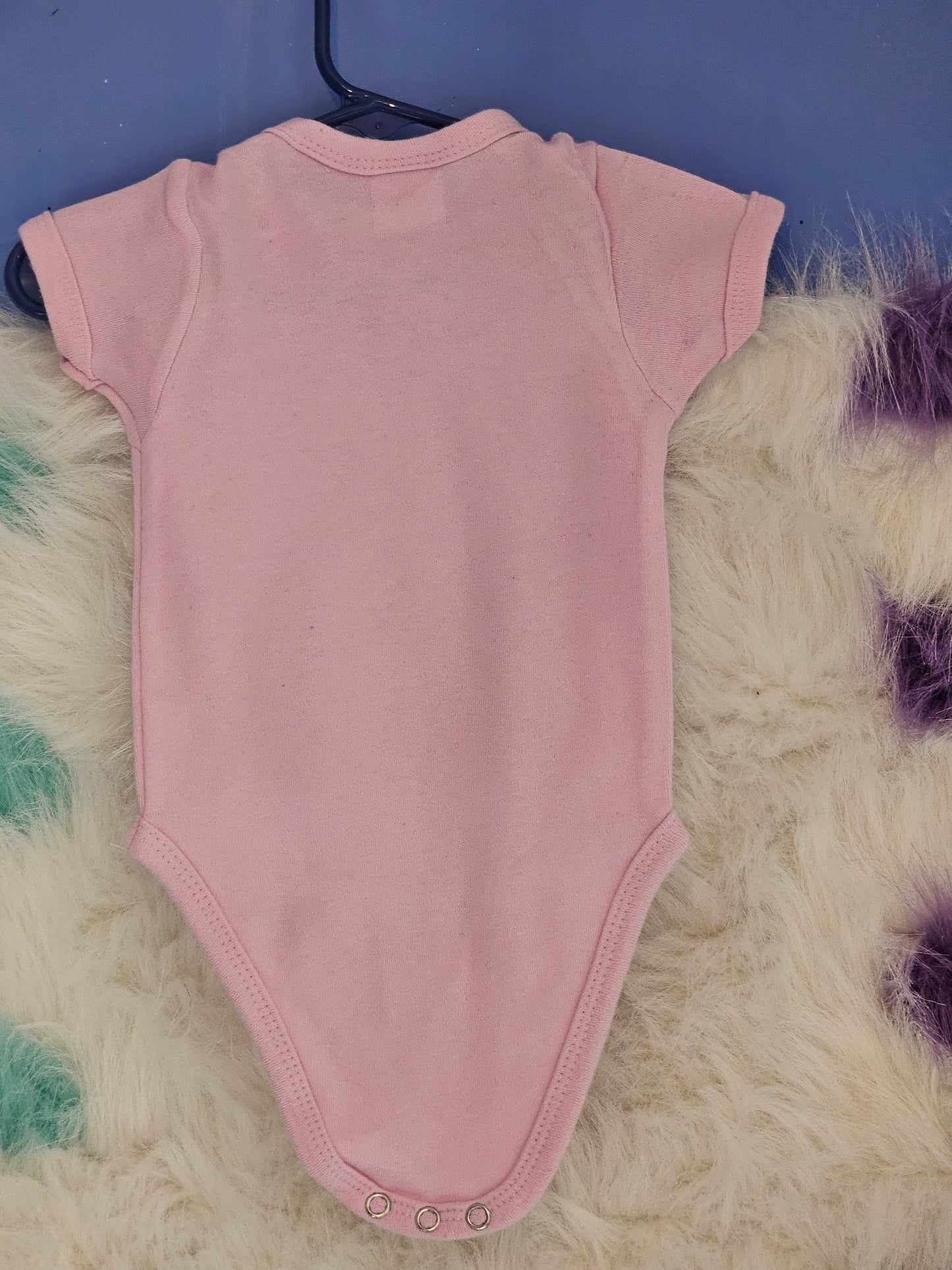 Size 0-3 months 100% cotton Pink Personalized baby girl's Oneies with the letter D and name in the middle.