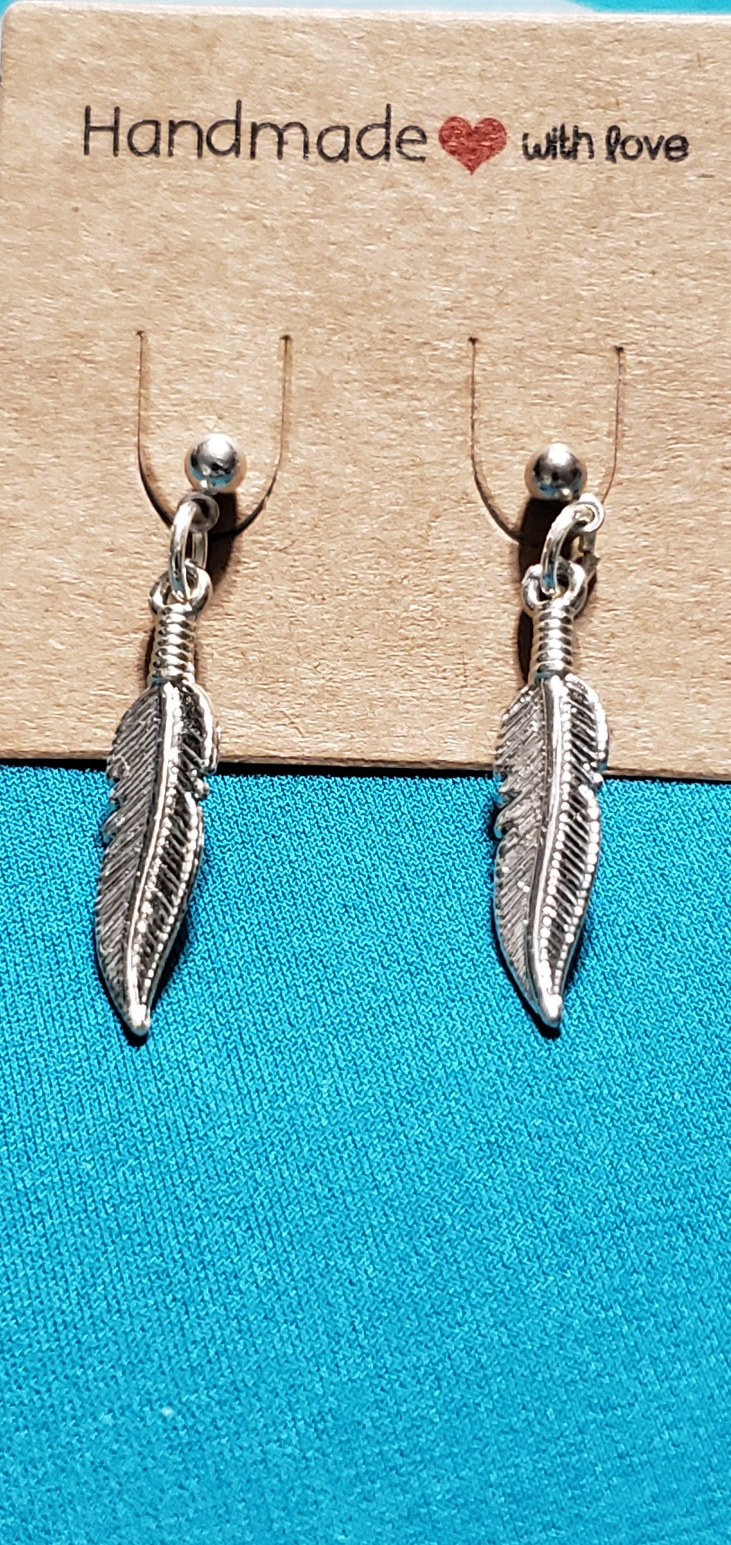 Stainless steel silver plated feather post earrings