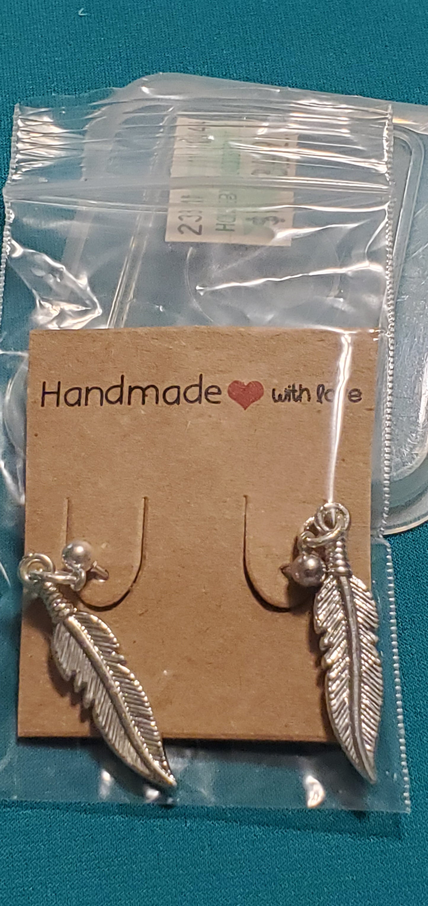 Stainless steel silver plated feather post earrings