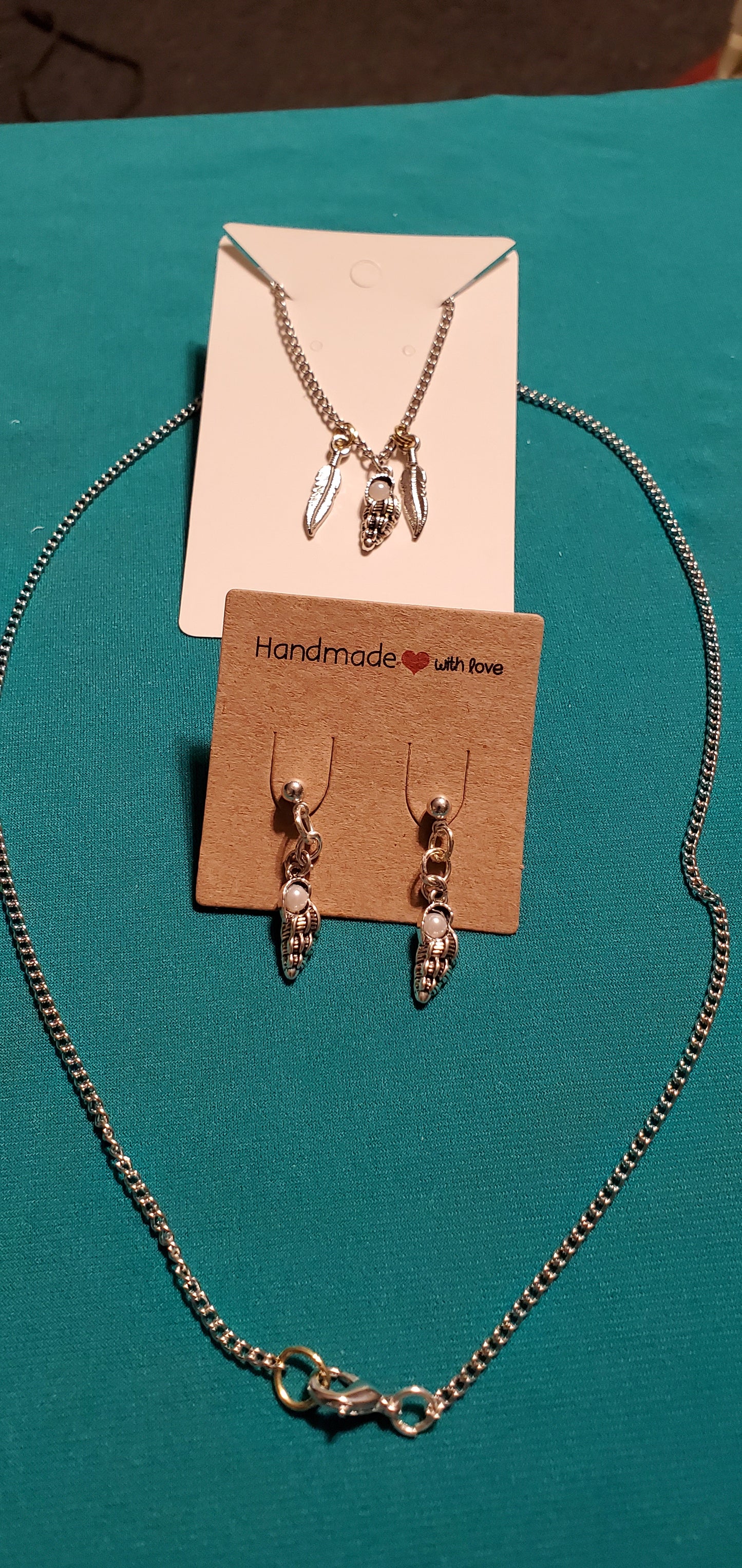 Stainless steel silver plated angel wings and feather necklace