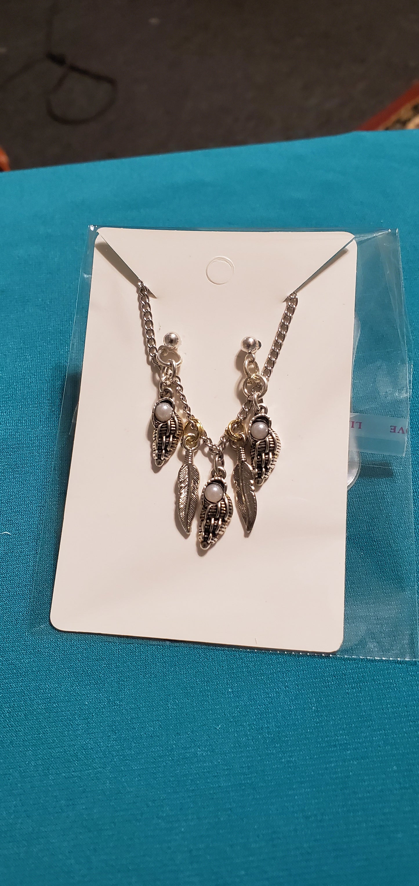 Stainless steel silver plated angel wings with feathers necklace and angel earrings