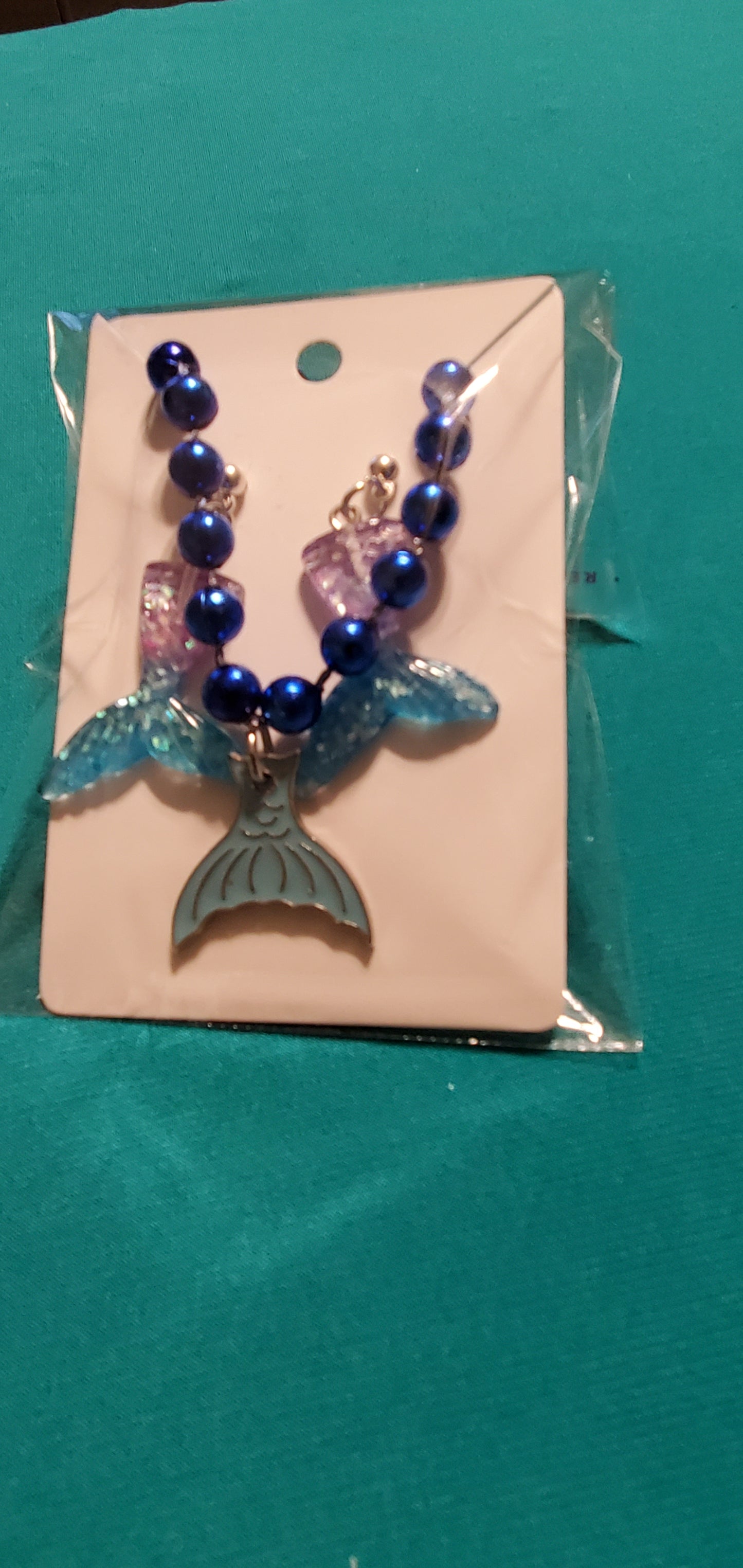 Mermaid tail on blue beaded necklace