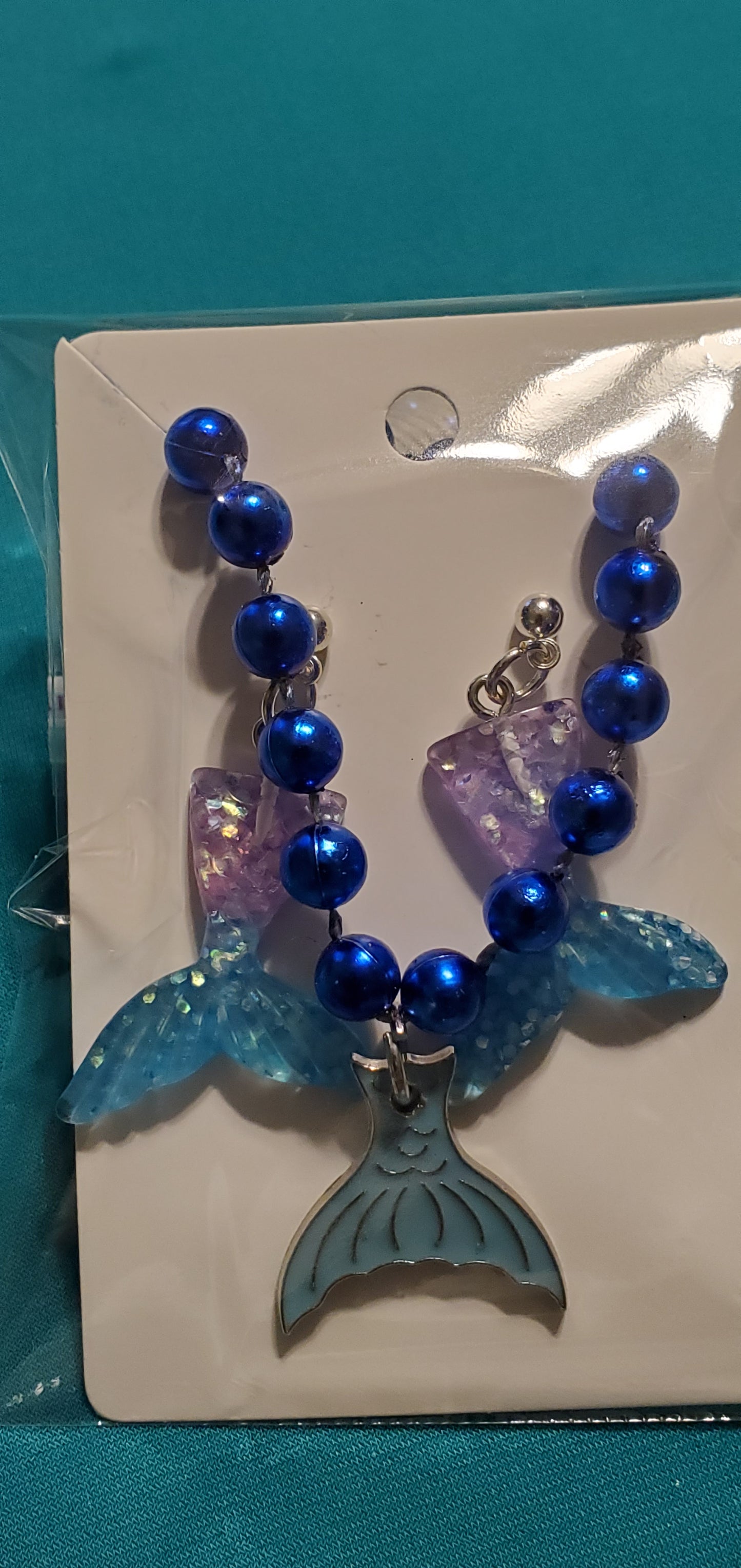 Mermaid tail on blue beaded necklace