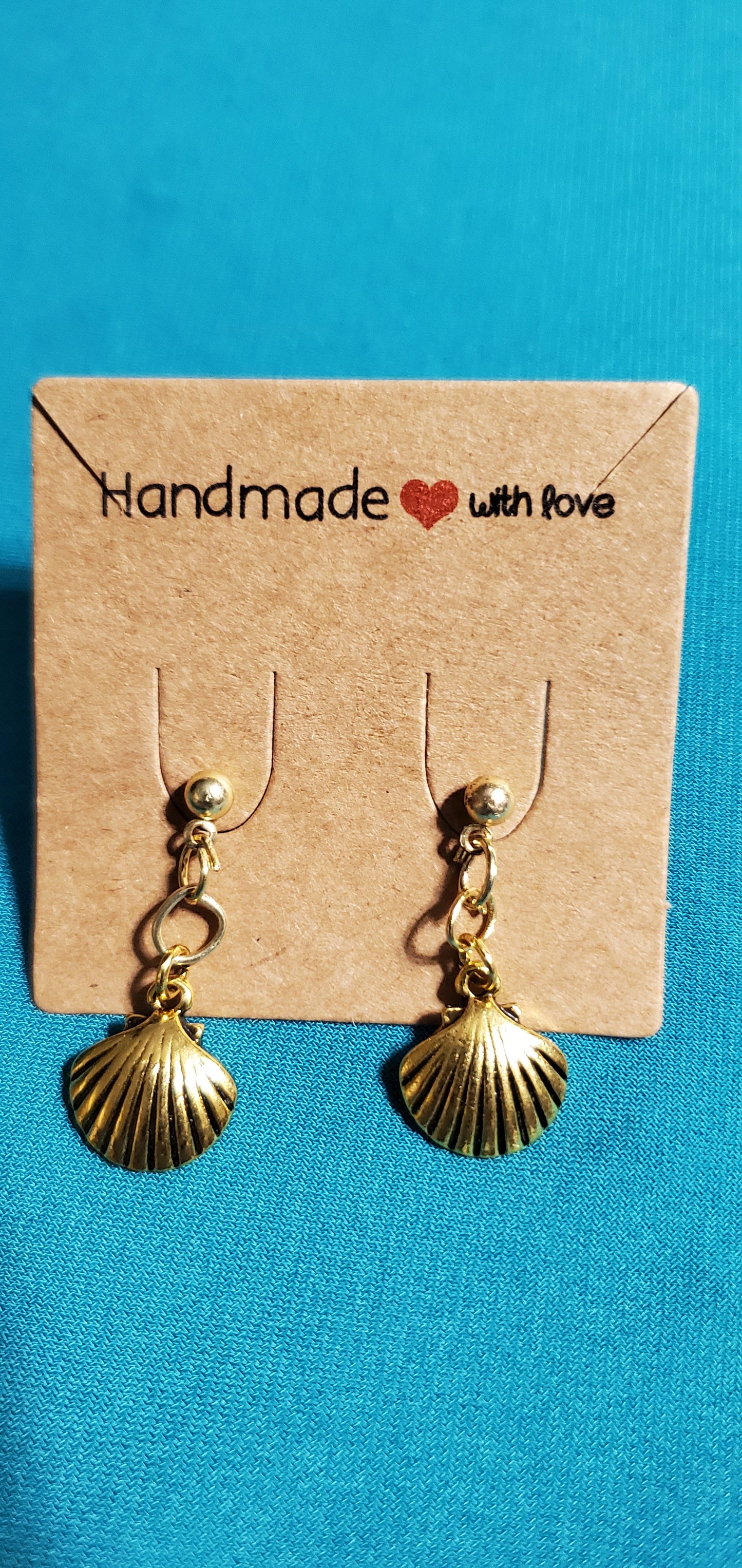 Gold plated star necklace and sea shell earrings