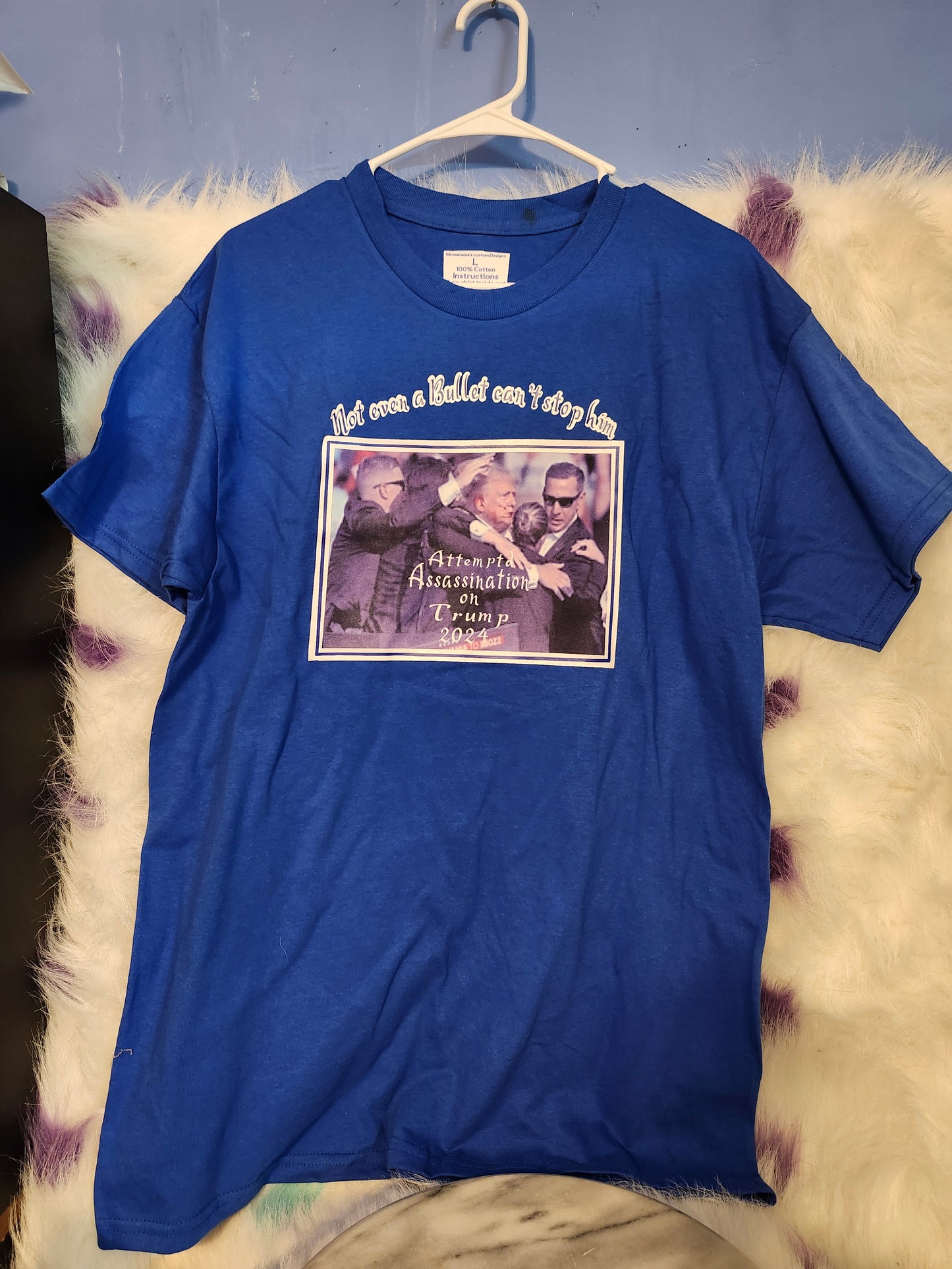 Size L 100% blue cotton Not even a bullet can stop him