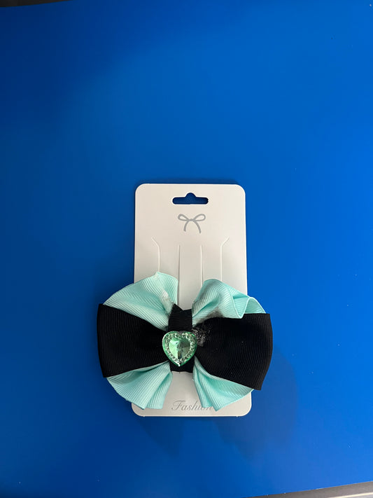 Light green and black hair bow with green heart.