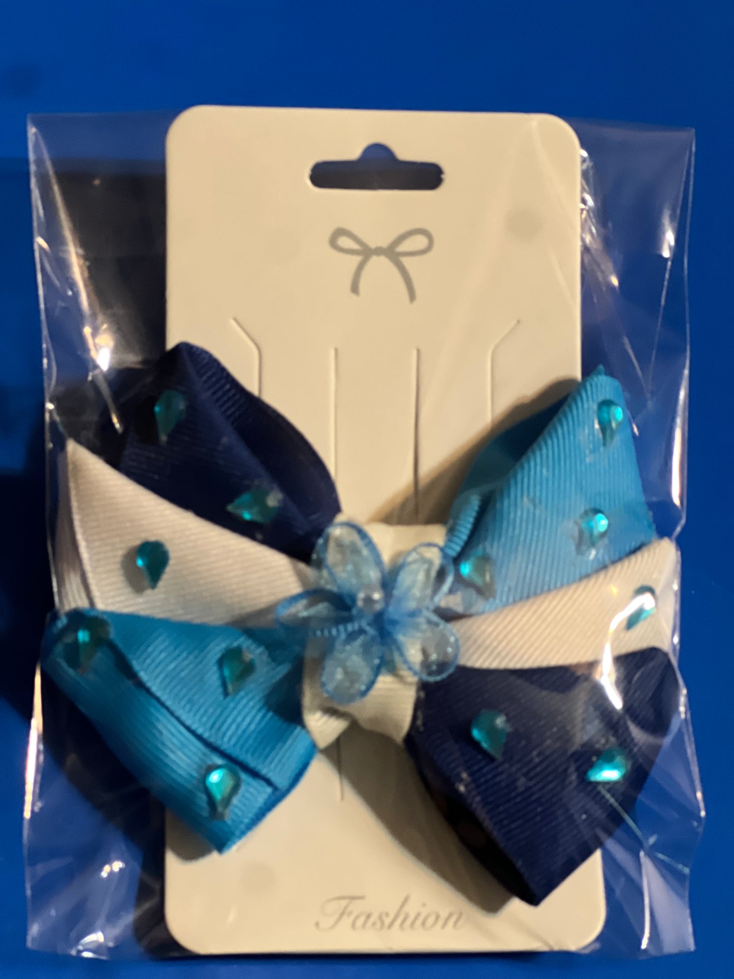 Dark blue,light blue and white hair bow with little blue gems