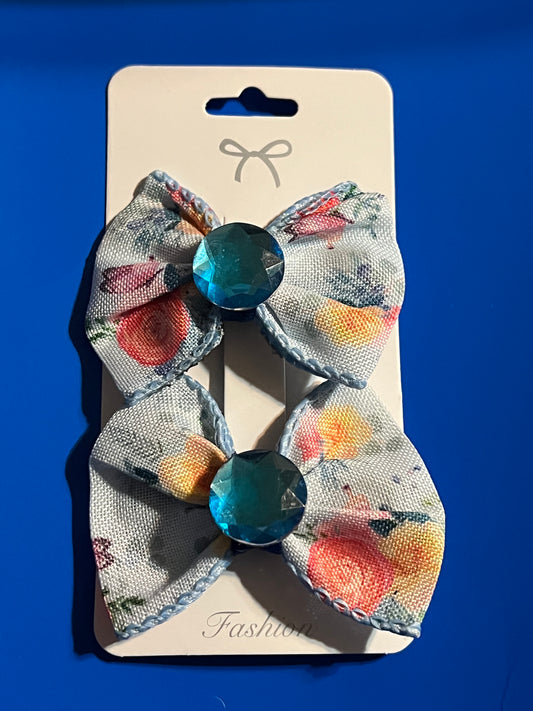 2 small blue hair bows