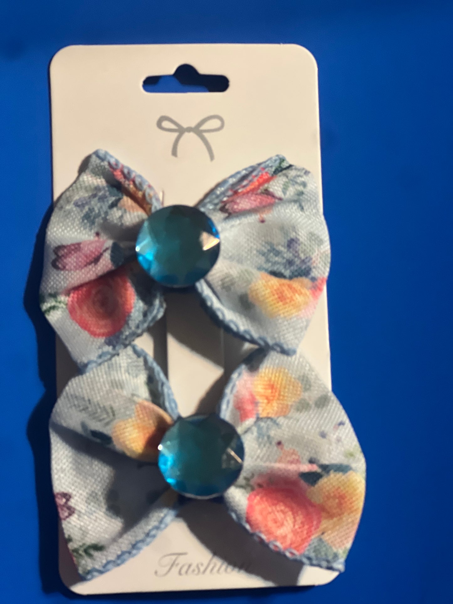 2 little girls blue hair bows