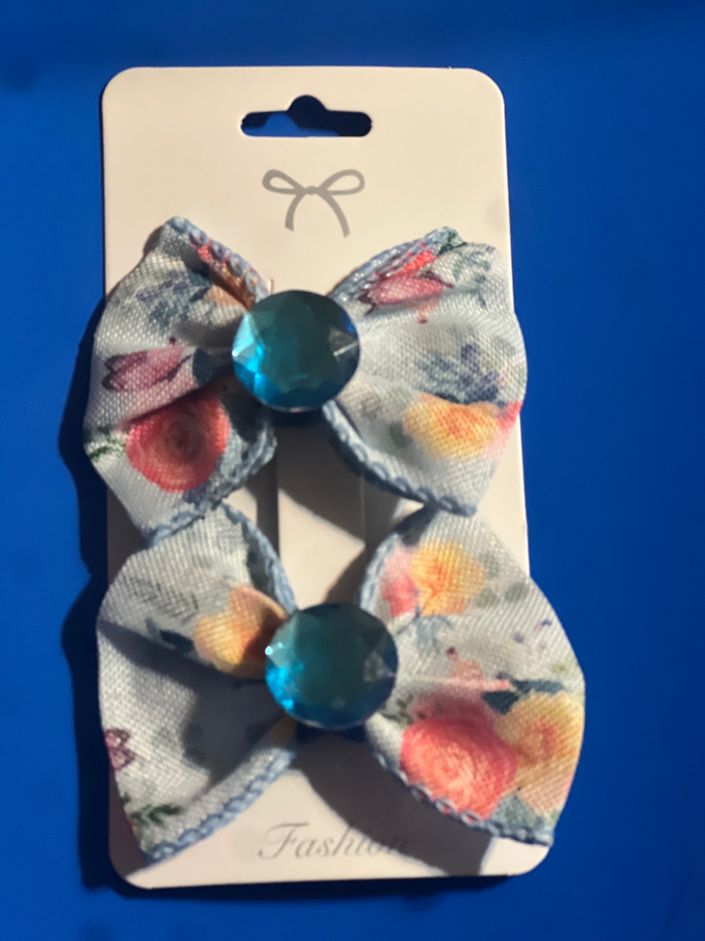 2 little girls blue hair bows