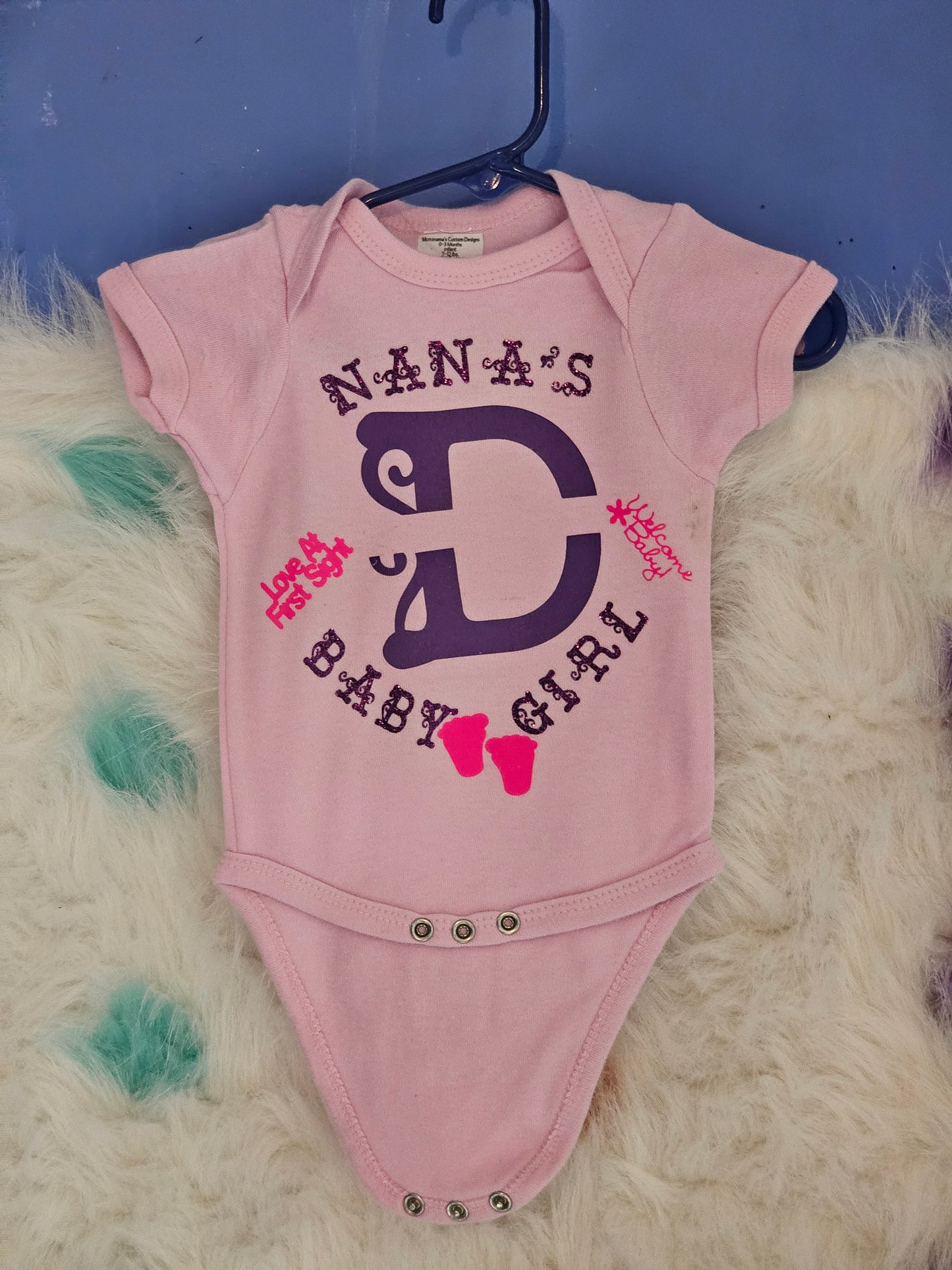 Size 0-3 months 100% cotton Pink Personalized baby girl's Oneies with the letter D and name in the middle.