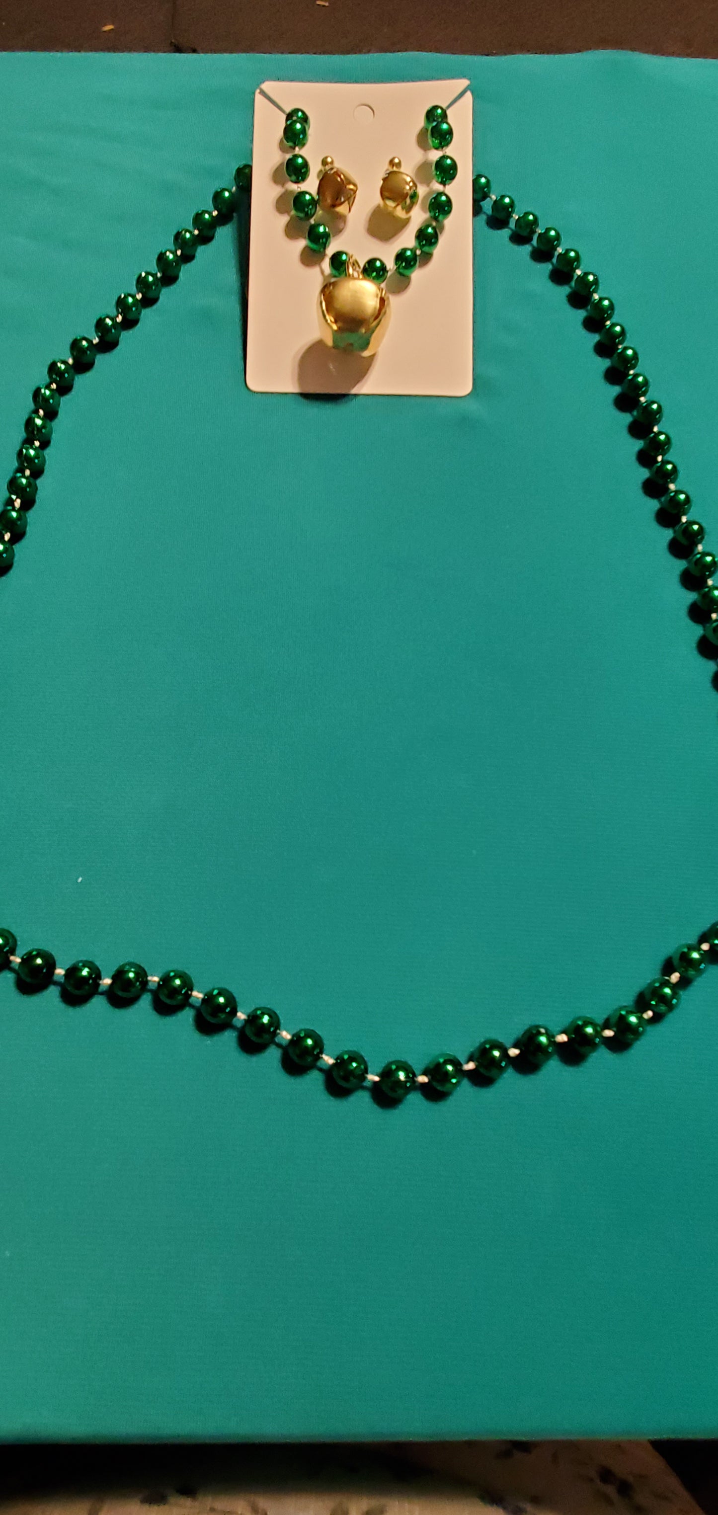 Christmas bells on green beaded necklace