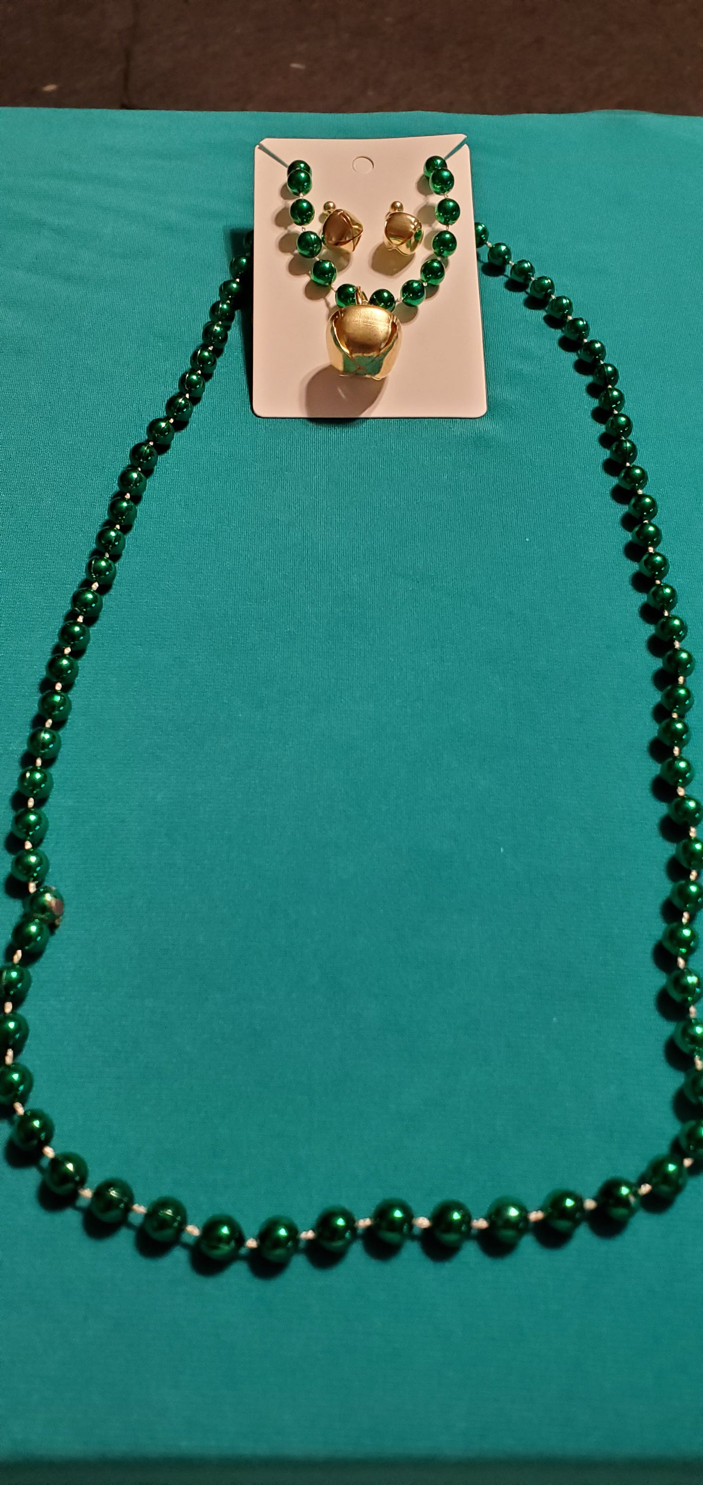 Christmas bells on green beaded necklace