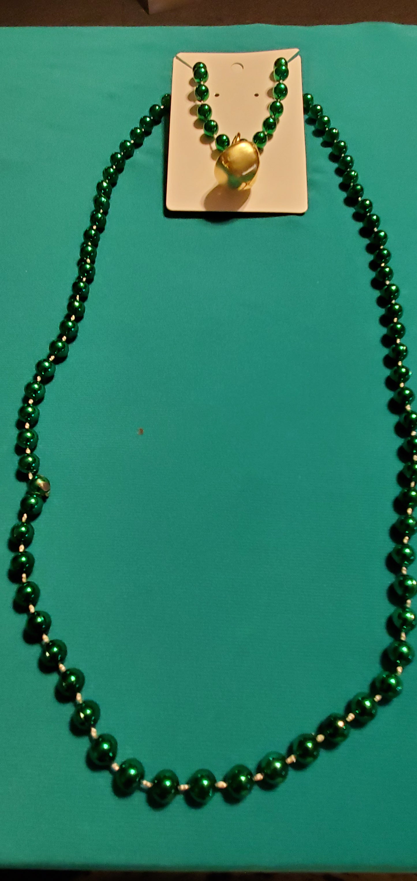 Christmas bells on green beaded necklace