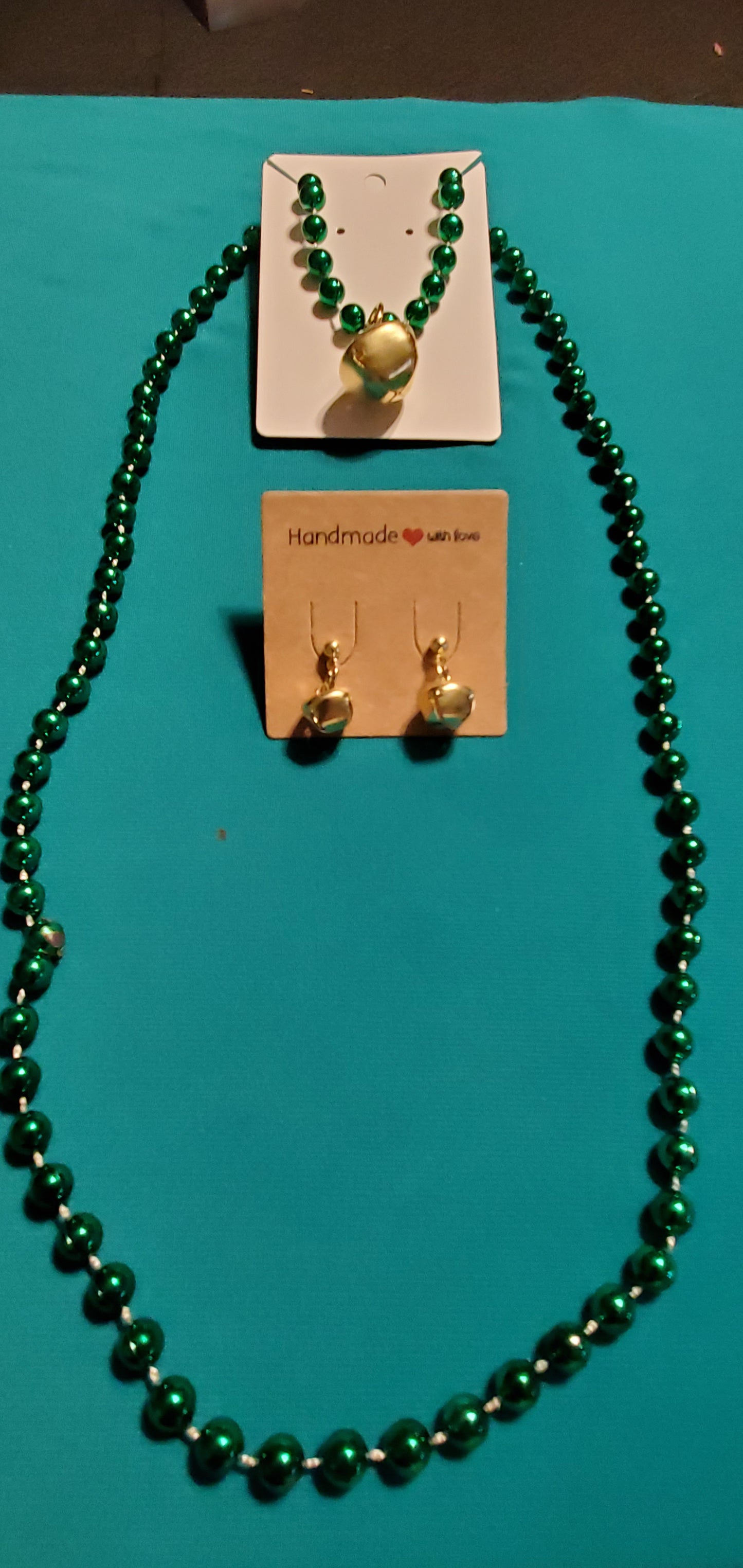 Christmas bells on green beaded necklace