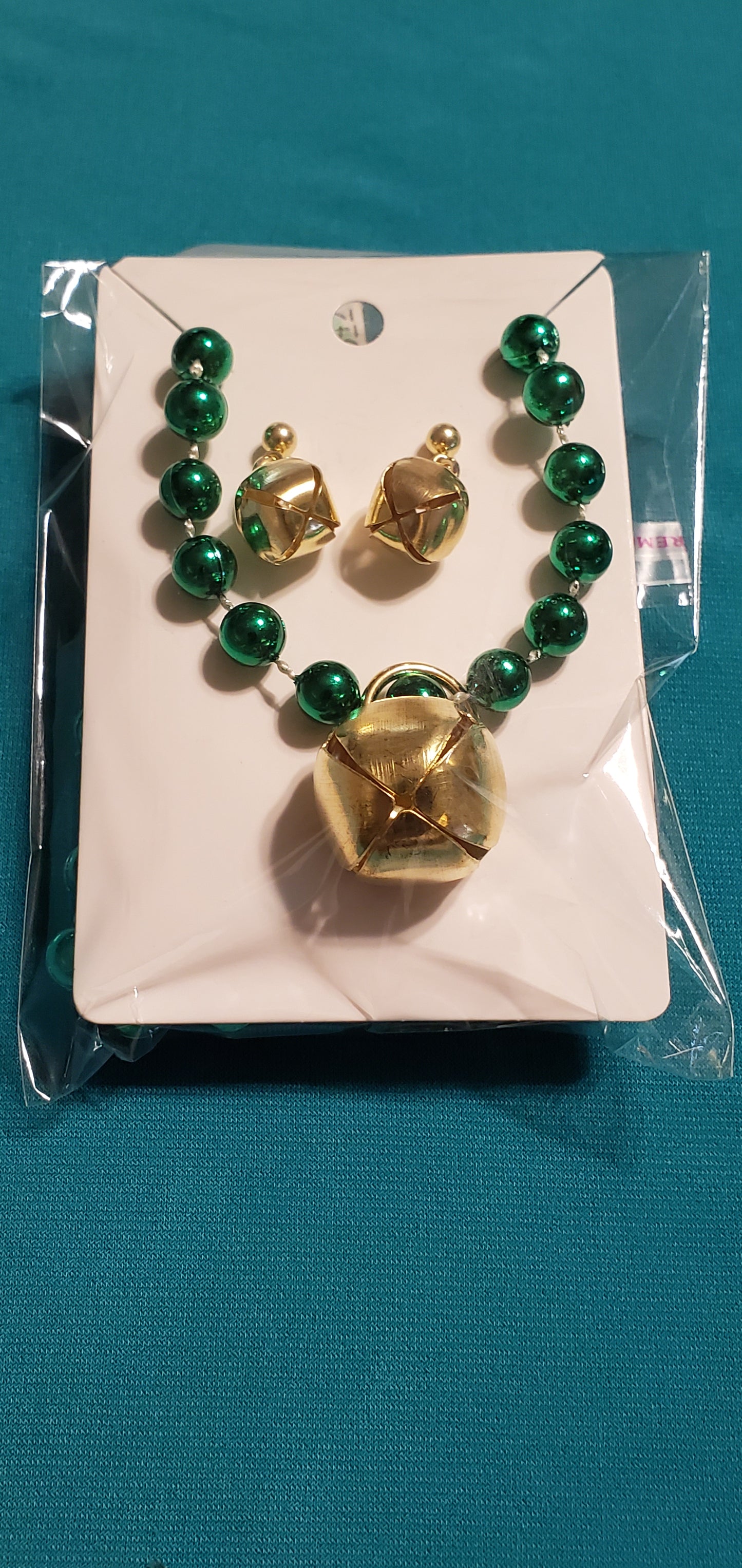 Christmas bells on green beaded necklace