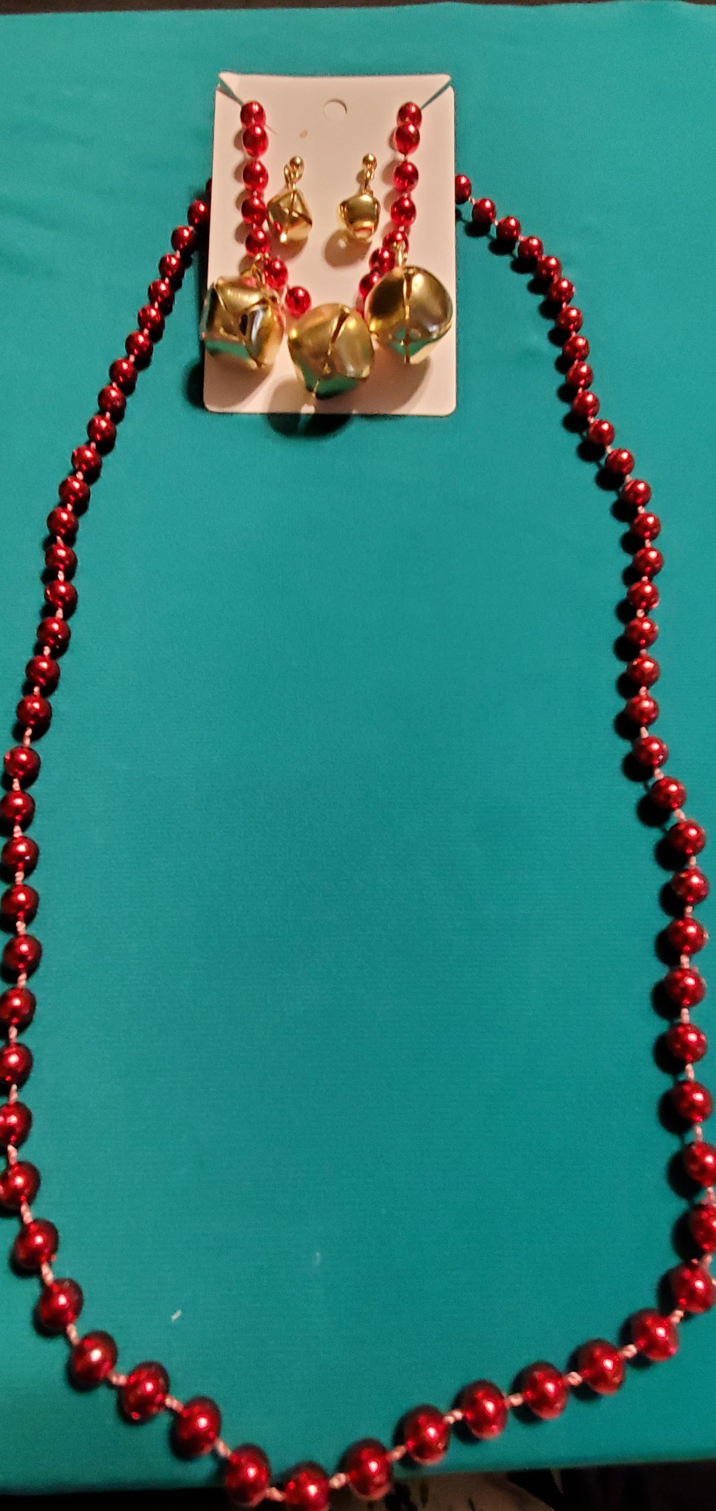 Christmas bells on red beaded necklace