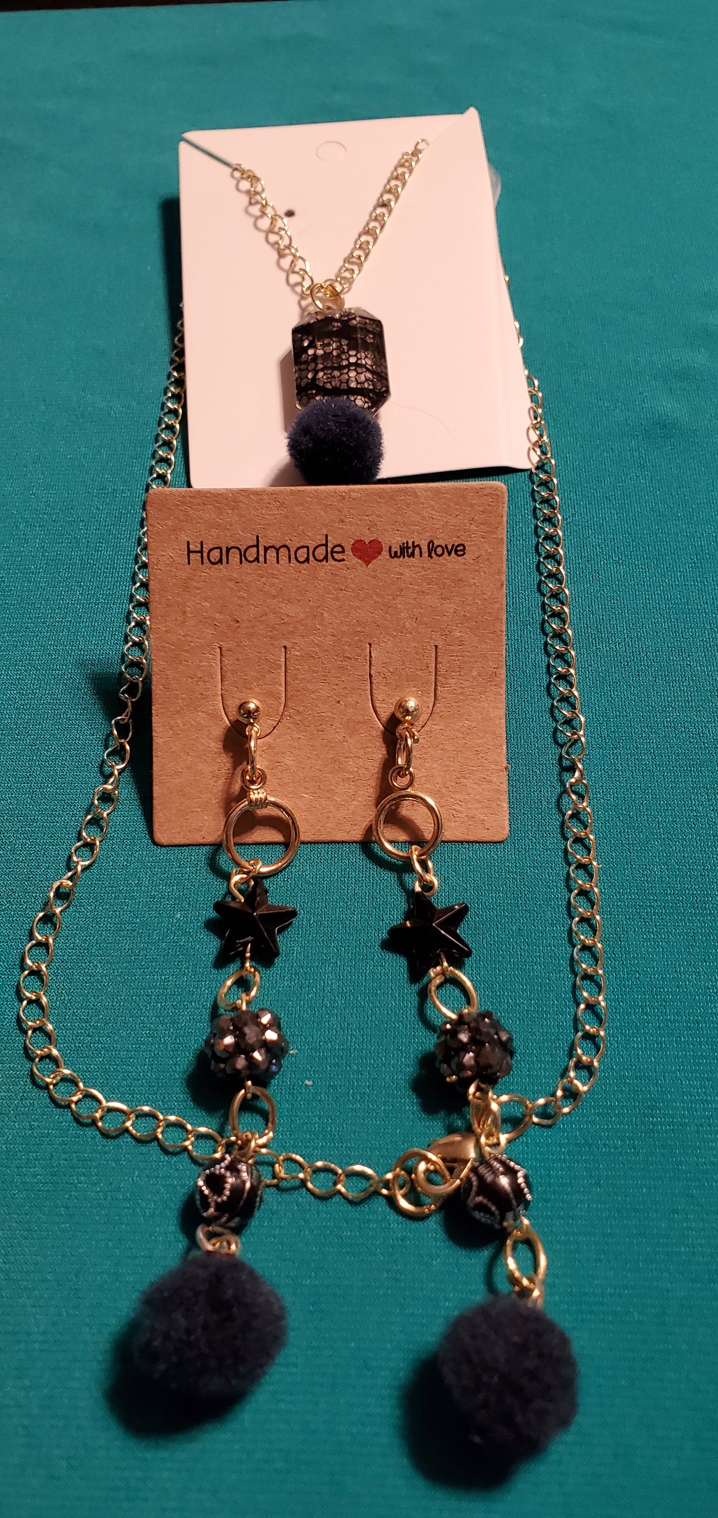 Gold plated black stars and fuzzy balls necklace and earrings