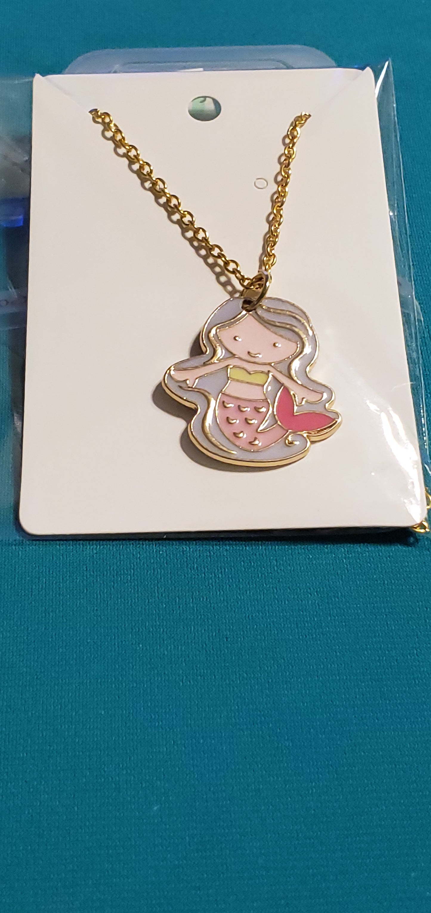 Little girl mermaid on gold plated necklace