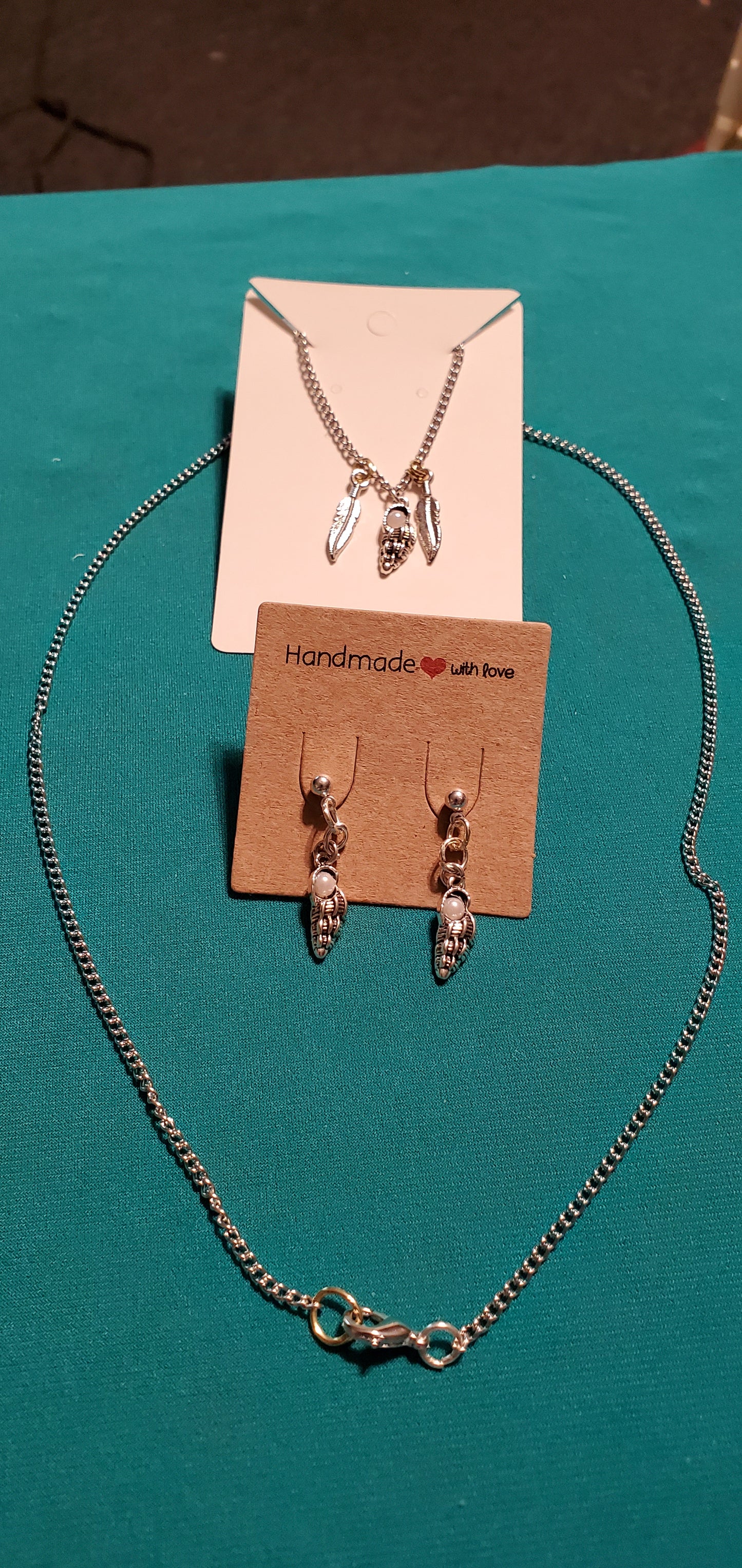 Stainless steel silver plated angel wings and feather necklace