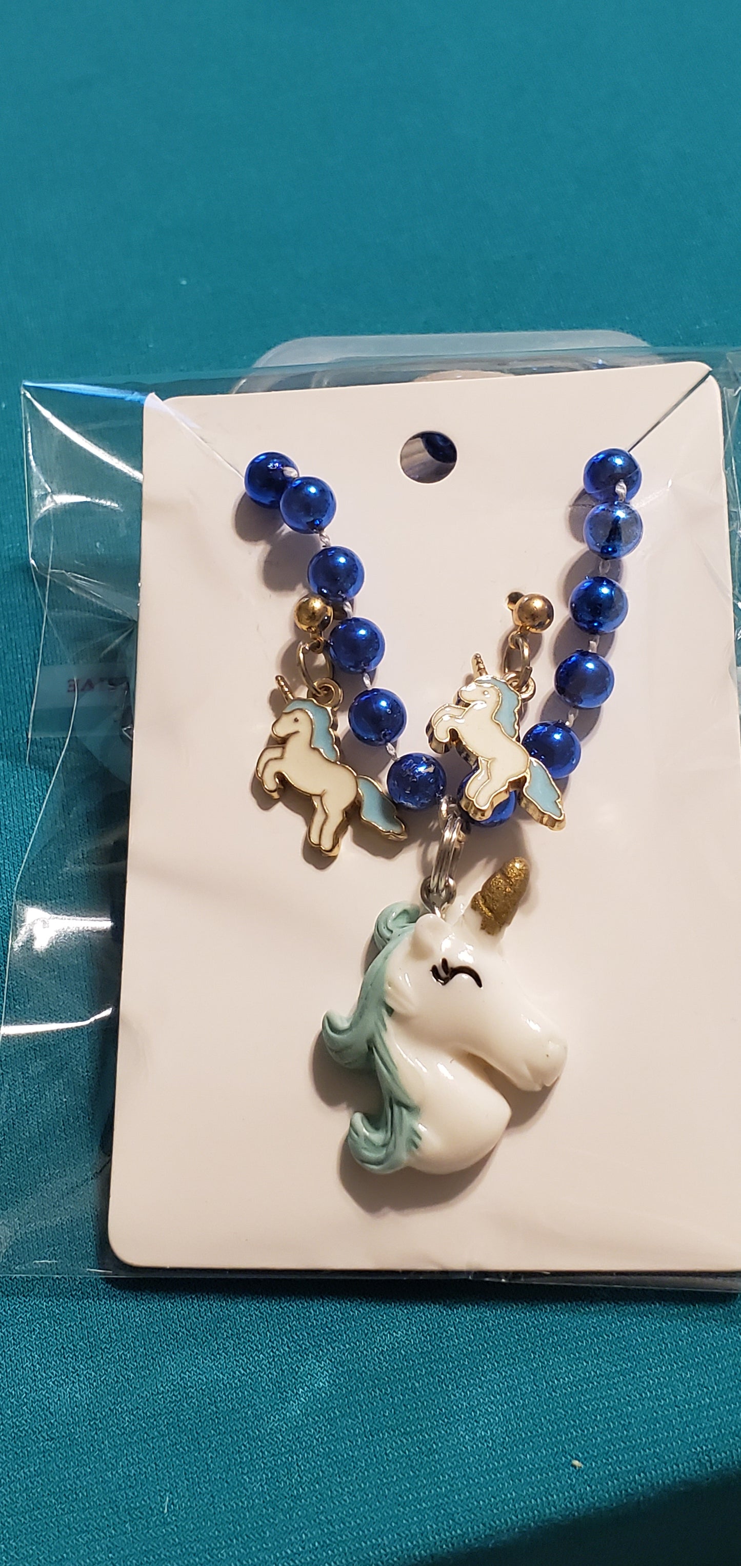 Blue & white Unicorn necklace and earrings