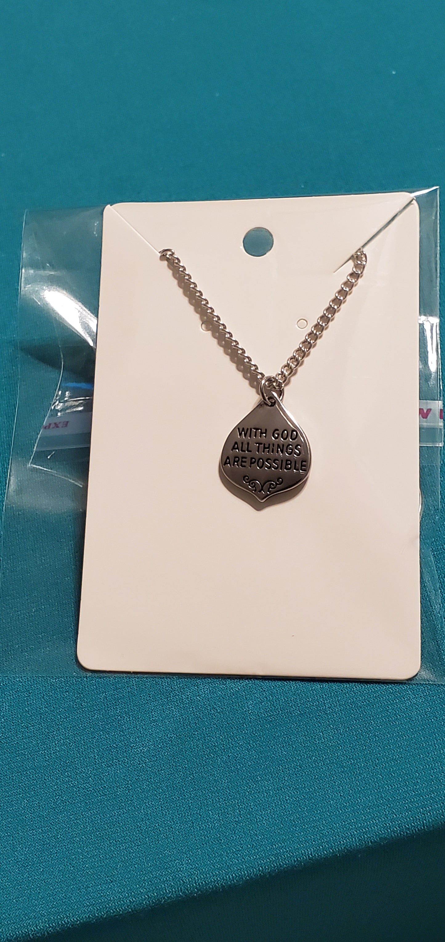 With god all things are possible charm on gold plated necklace