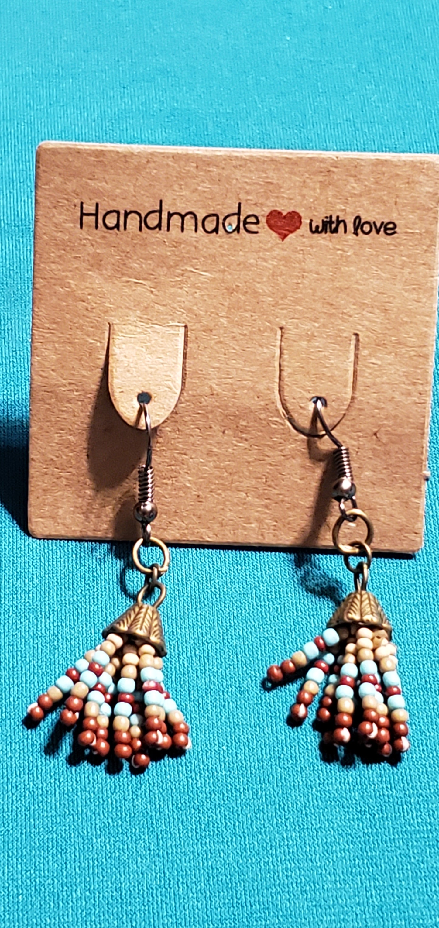 Indian head on bronze plated necklace and Indian beads on bronze plated post