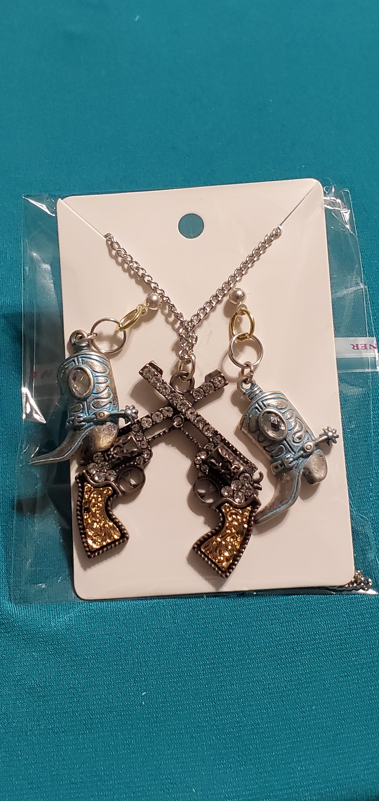 Cowgirl's guns bronze plated necklace