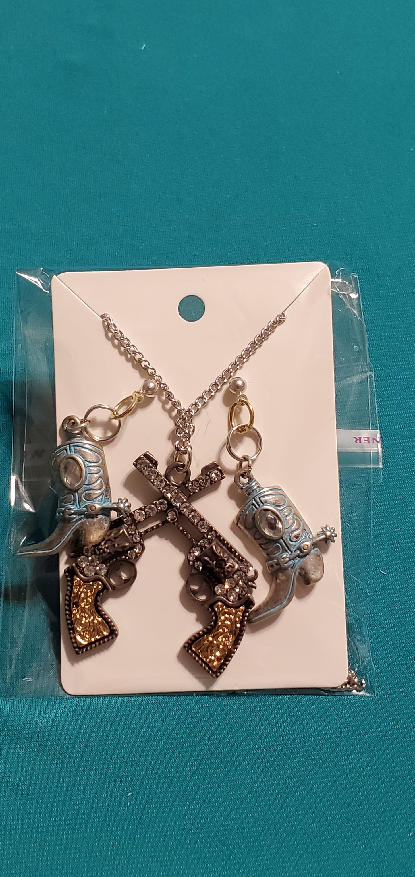Cowgirl's guns bronze plated necklace