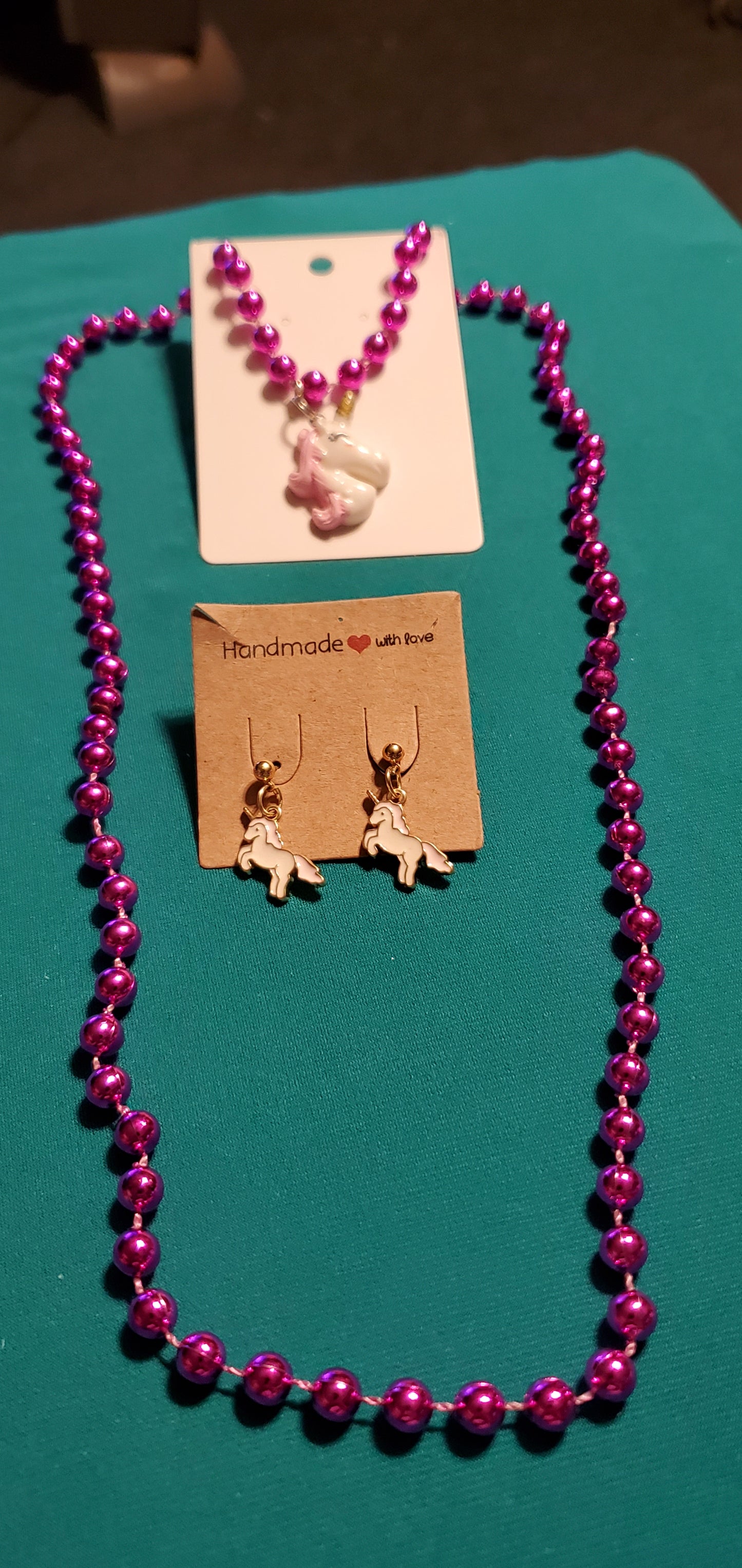 Pink & White unicorn on a pink beaded necklace and earrings