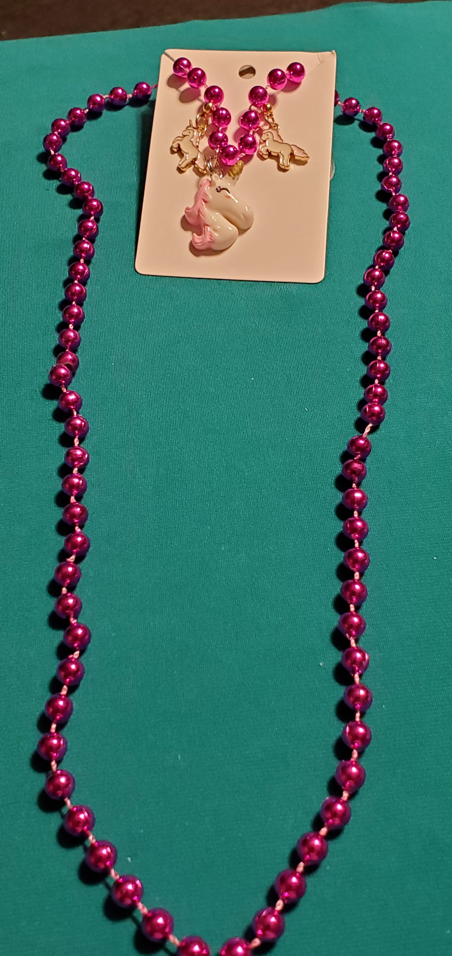 Pink and white unicorn on pink beaded necklace