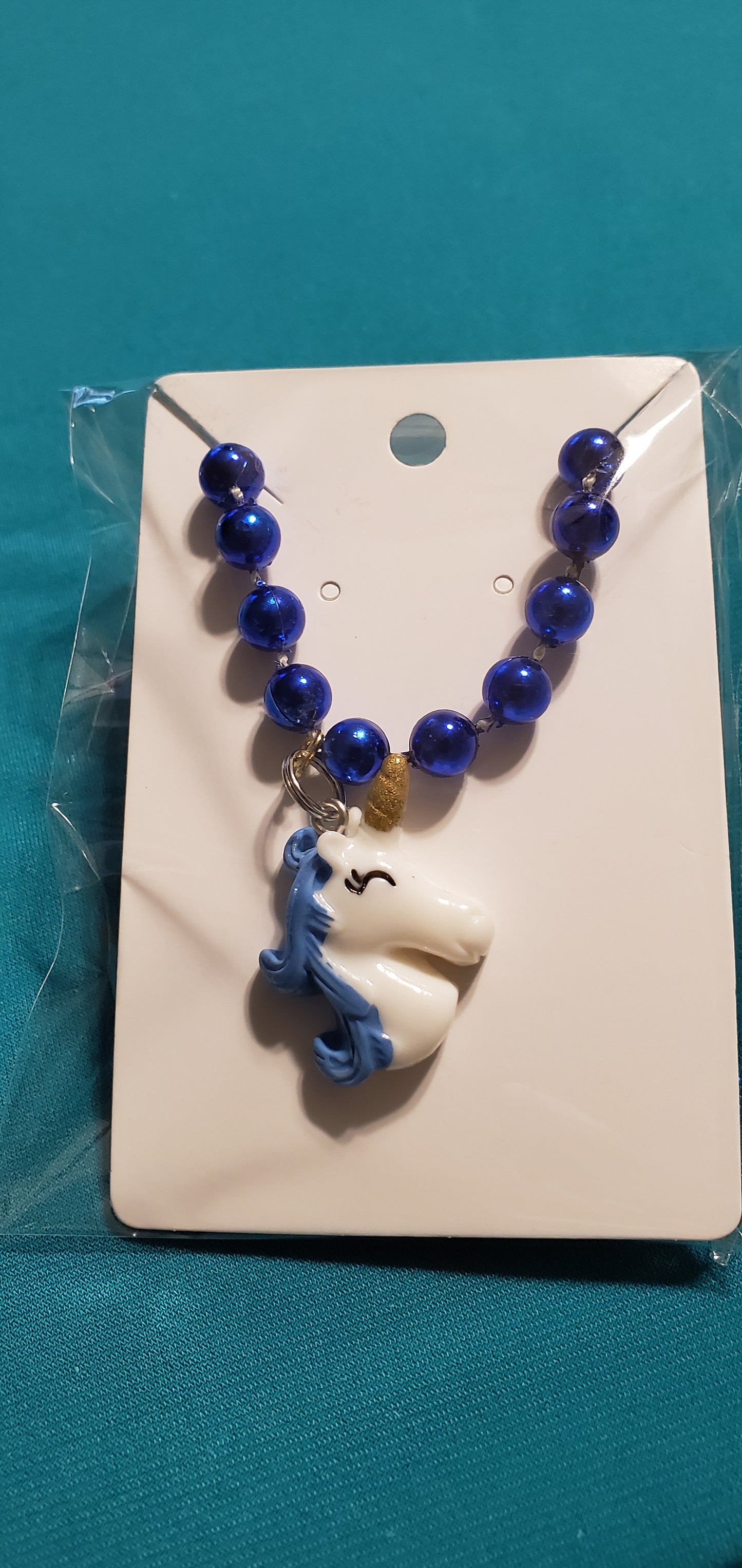 Blue & white Unicorn necklace and earrings