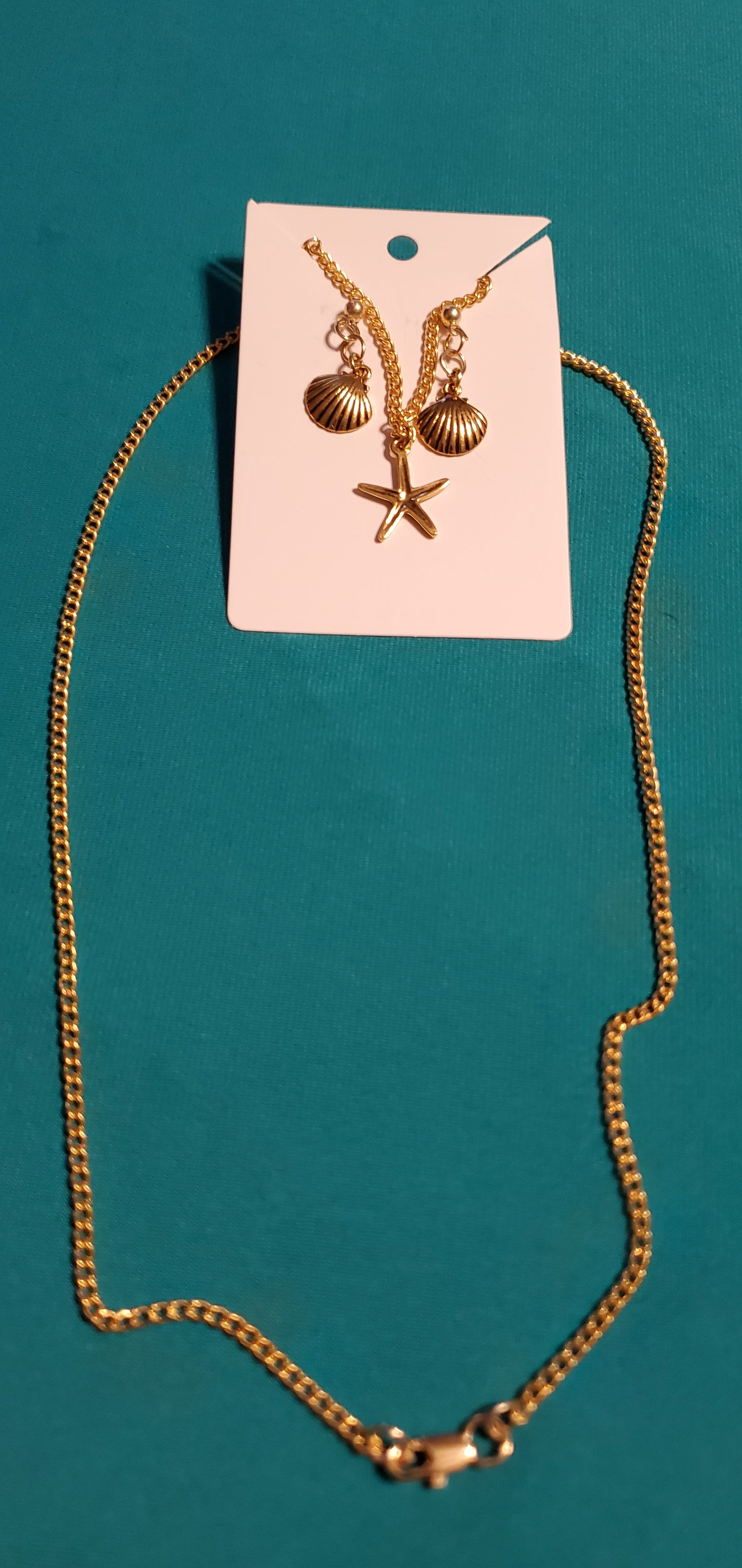 Gold plated star necklace and sea shell earrings