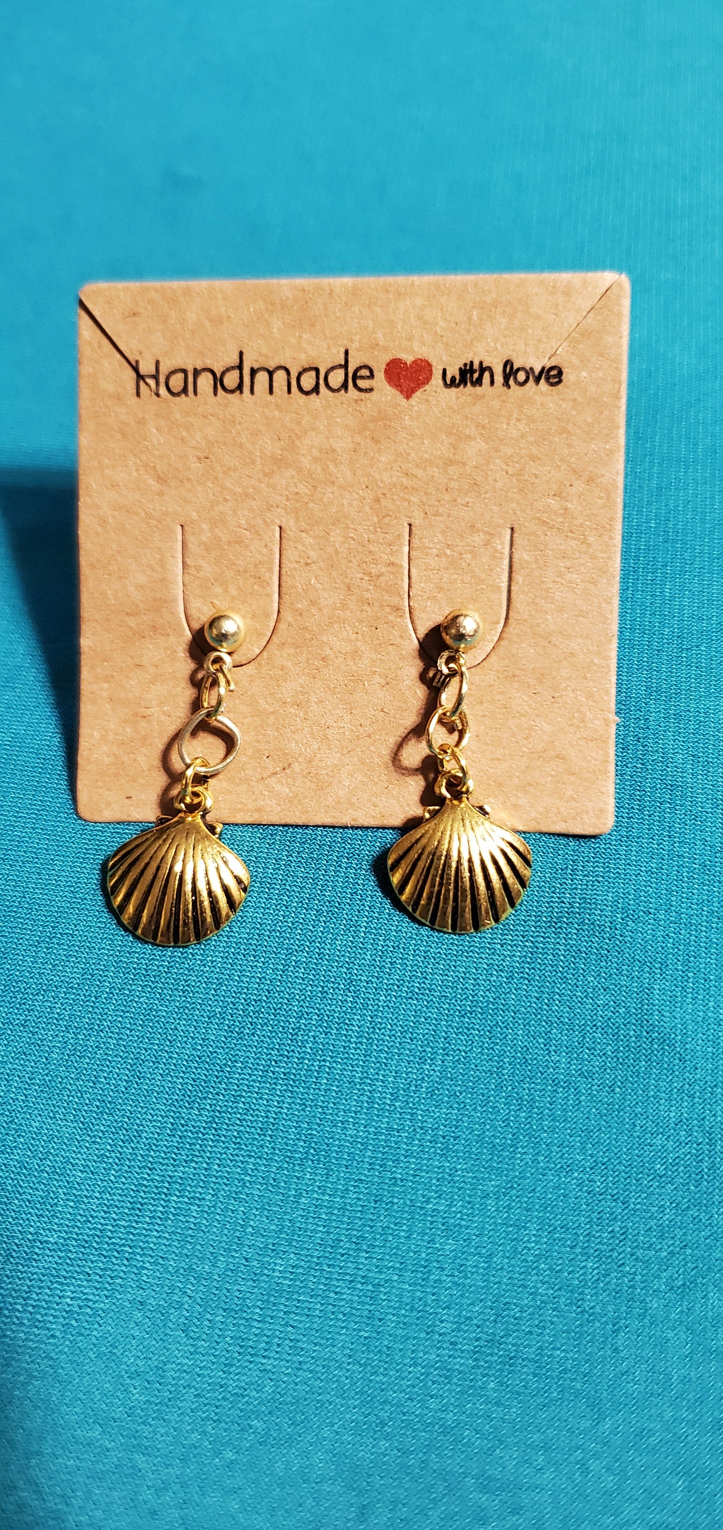 Gold plated star necklace and sea shell earrings