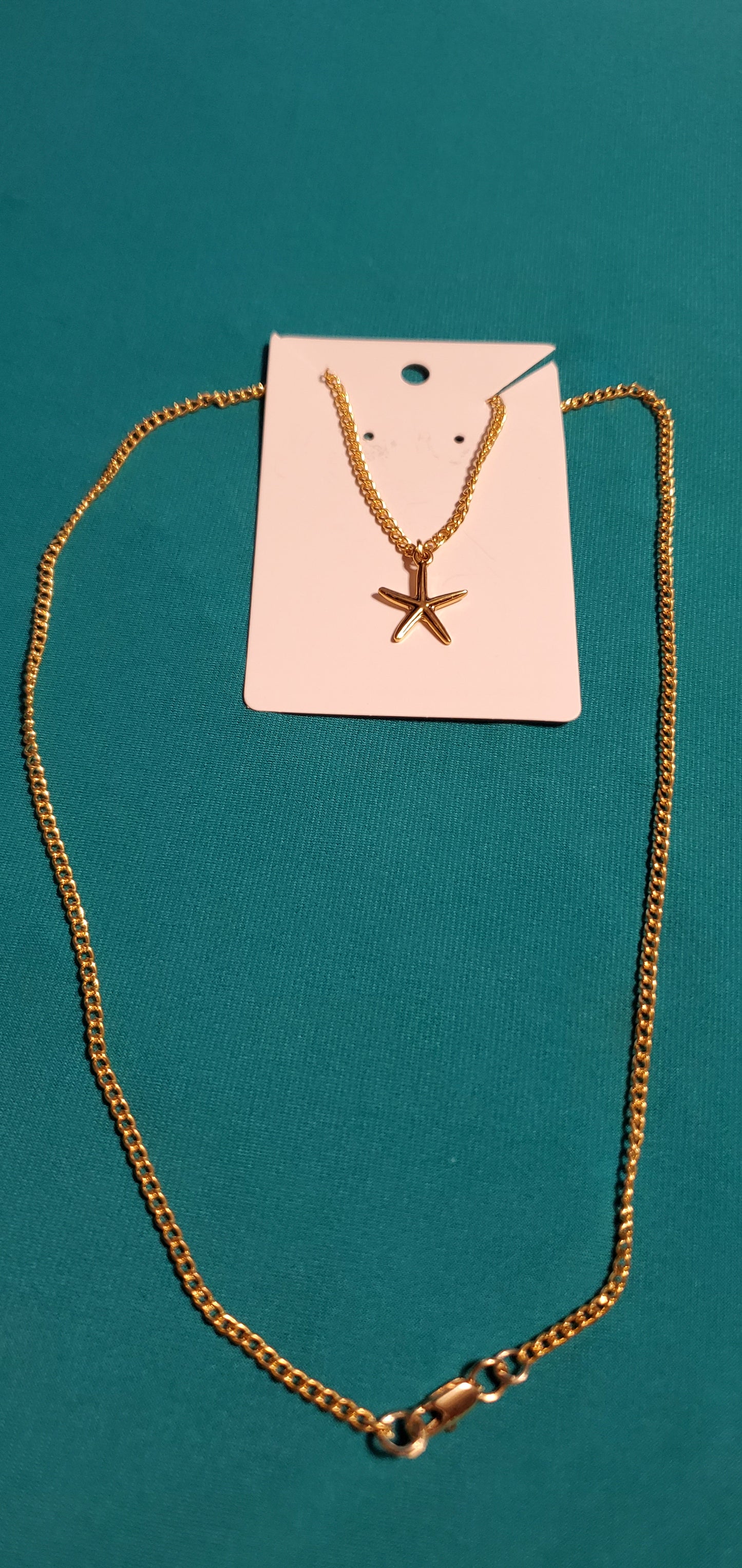 Gold plated star necklace and sea shell earrings