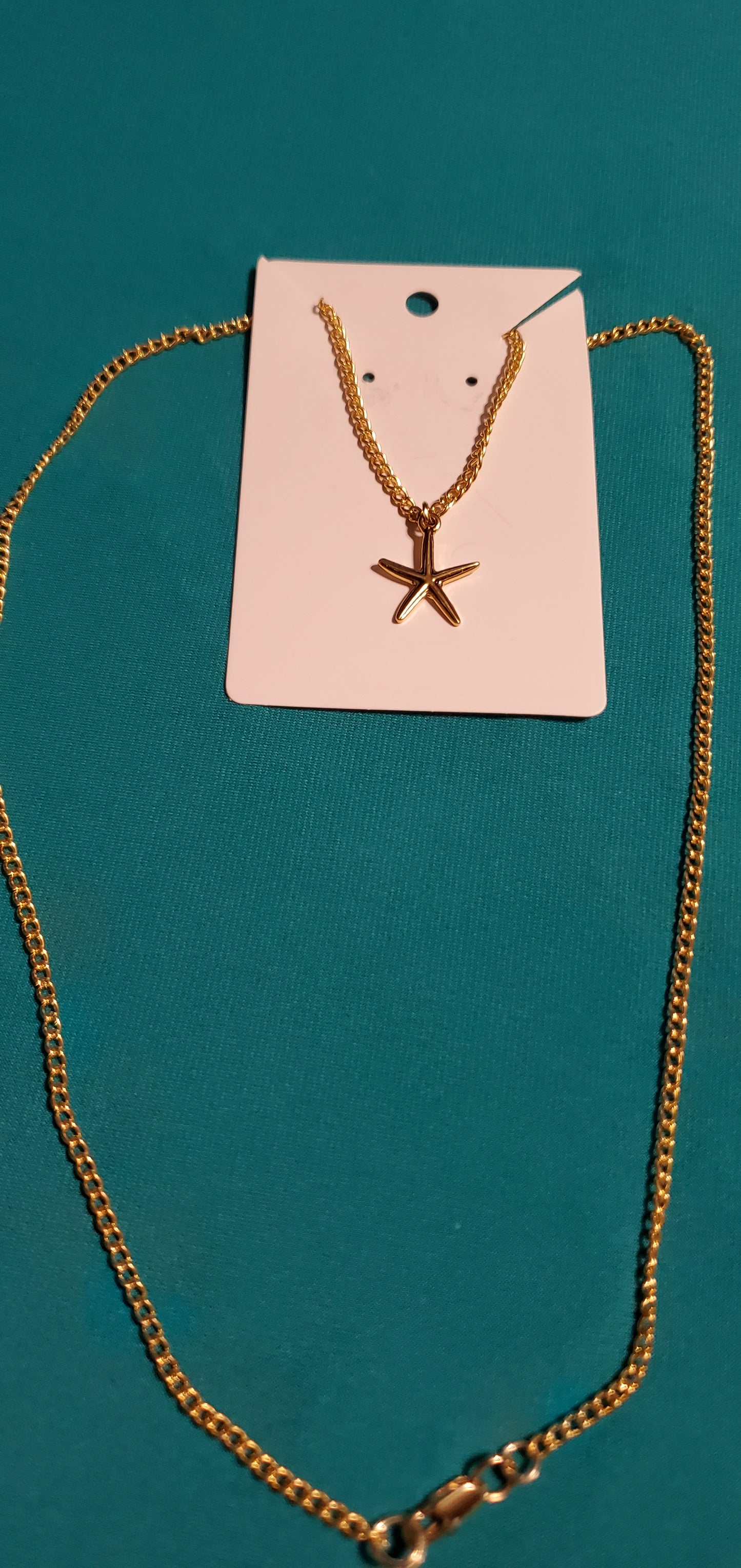 Gold plated star necklace and sea shell earrings