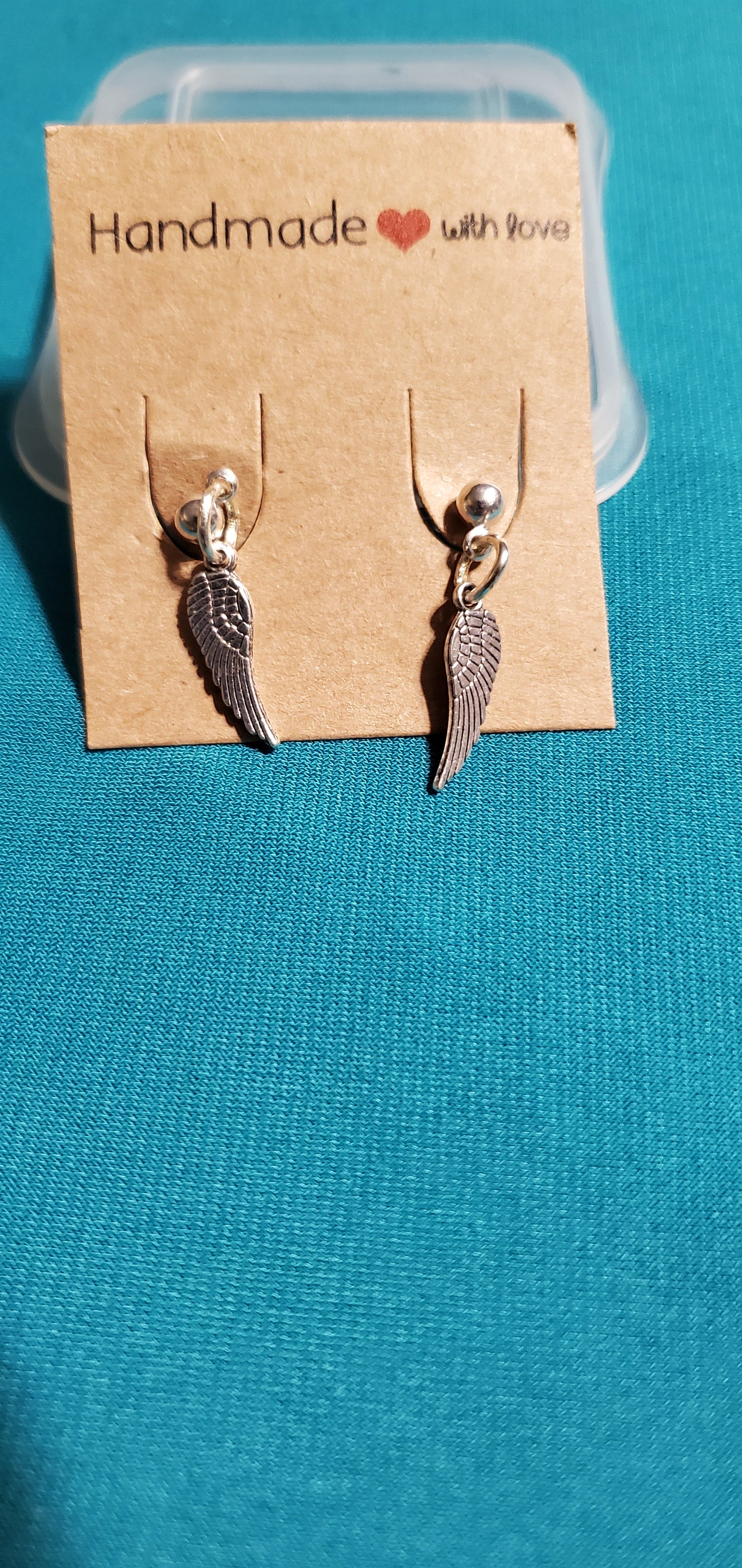 With god all things are possible on silver plated chain and angel wings earrings