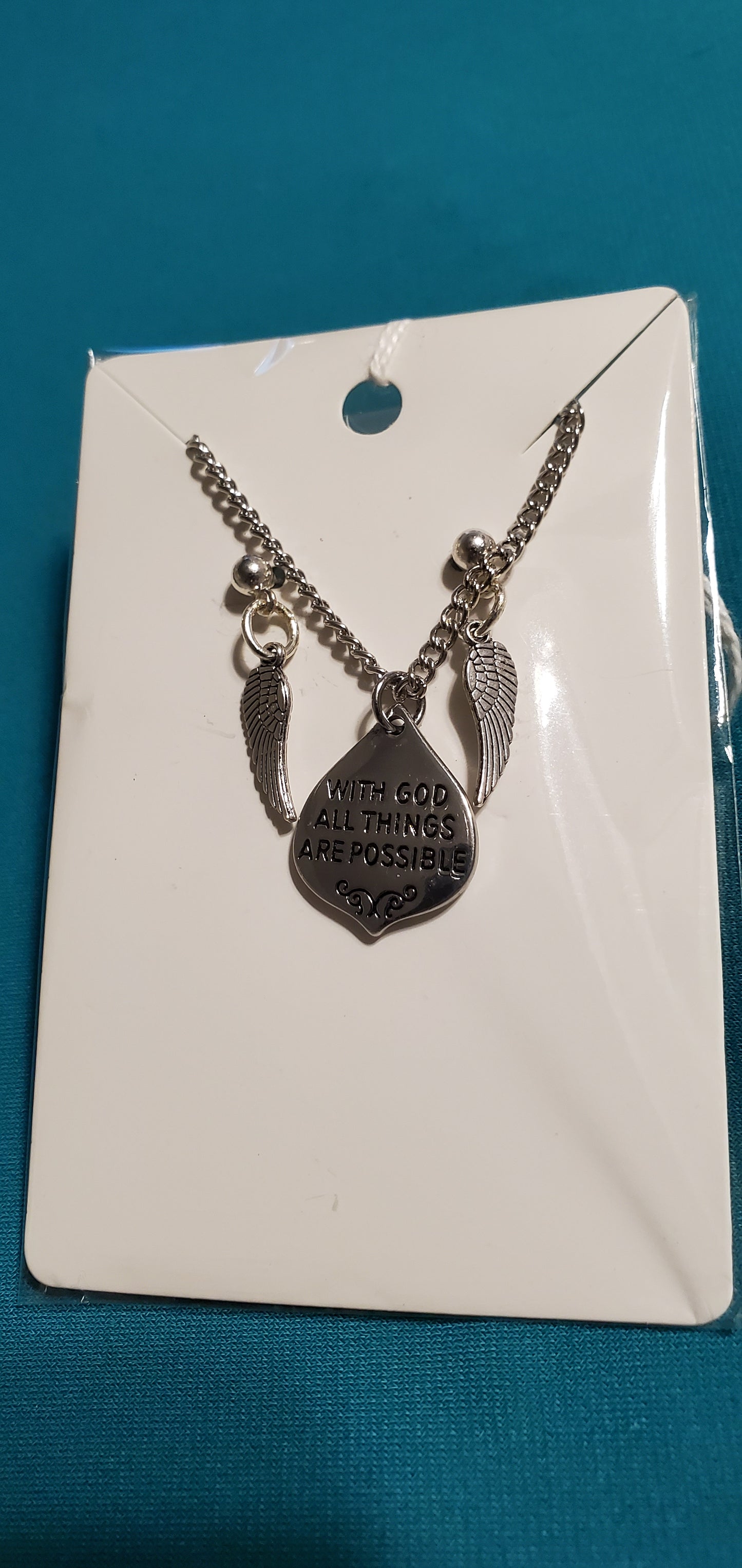 With god all things are possible on silver plated chain and angel wings earrings