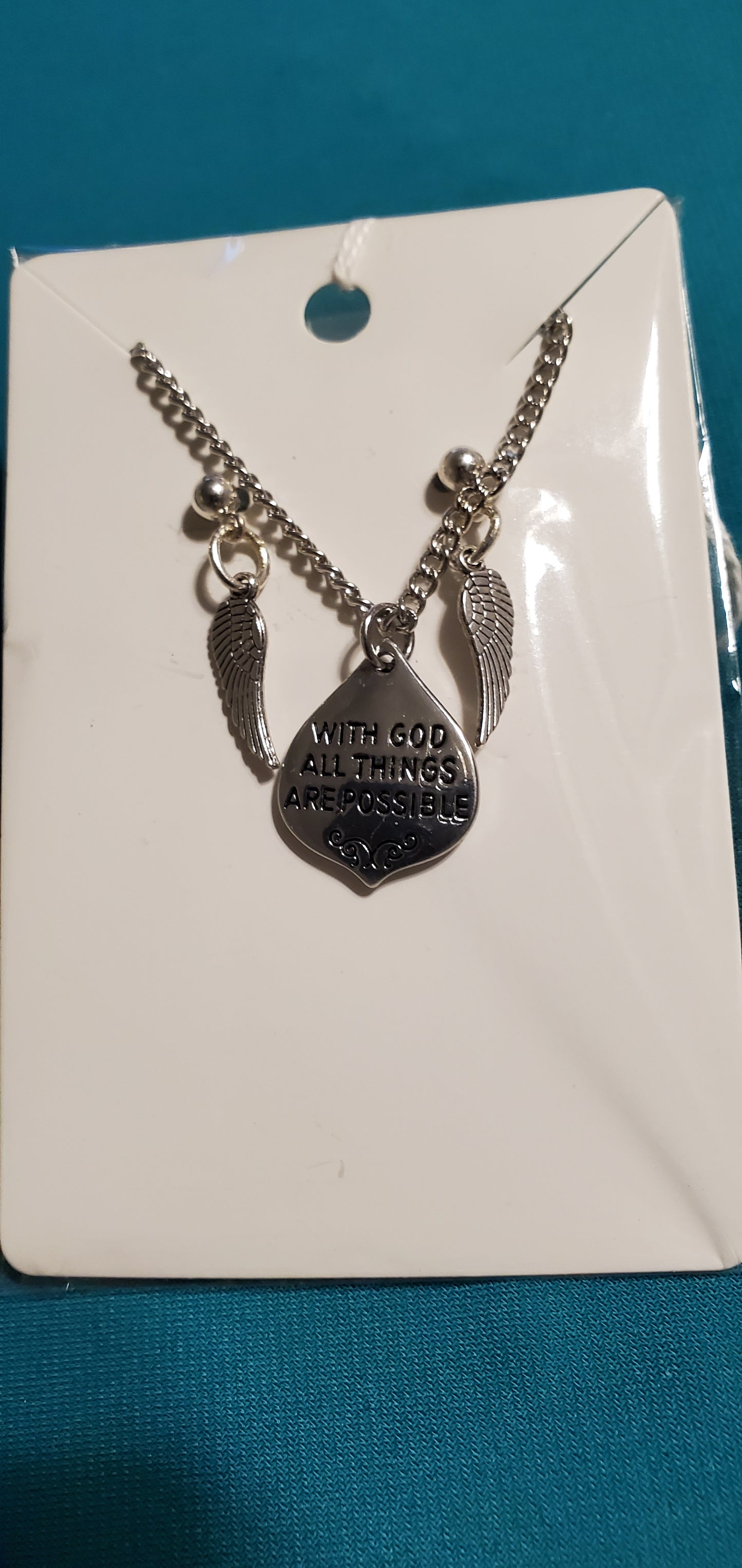 With god all things are possible on silver plated chain and angel wings earrings