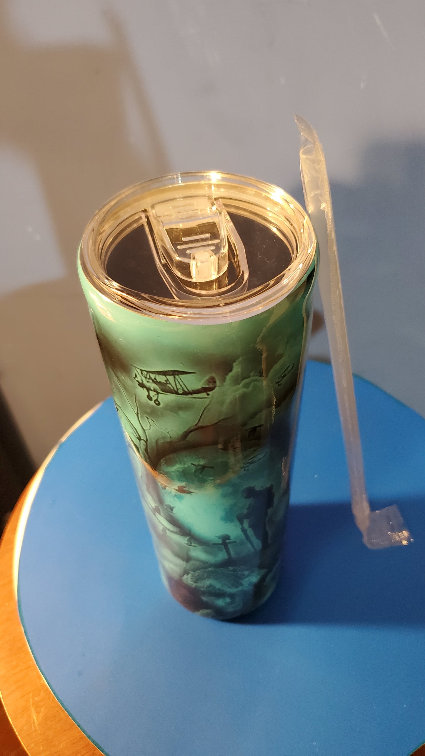 Man standing at a cross hogg tumbler cup